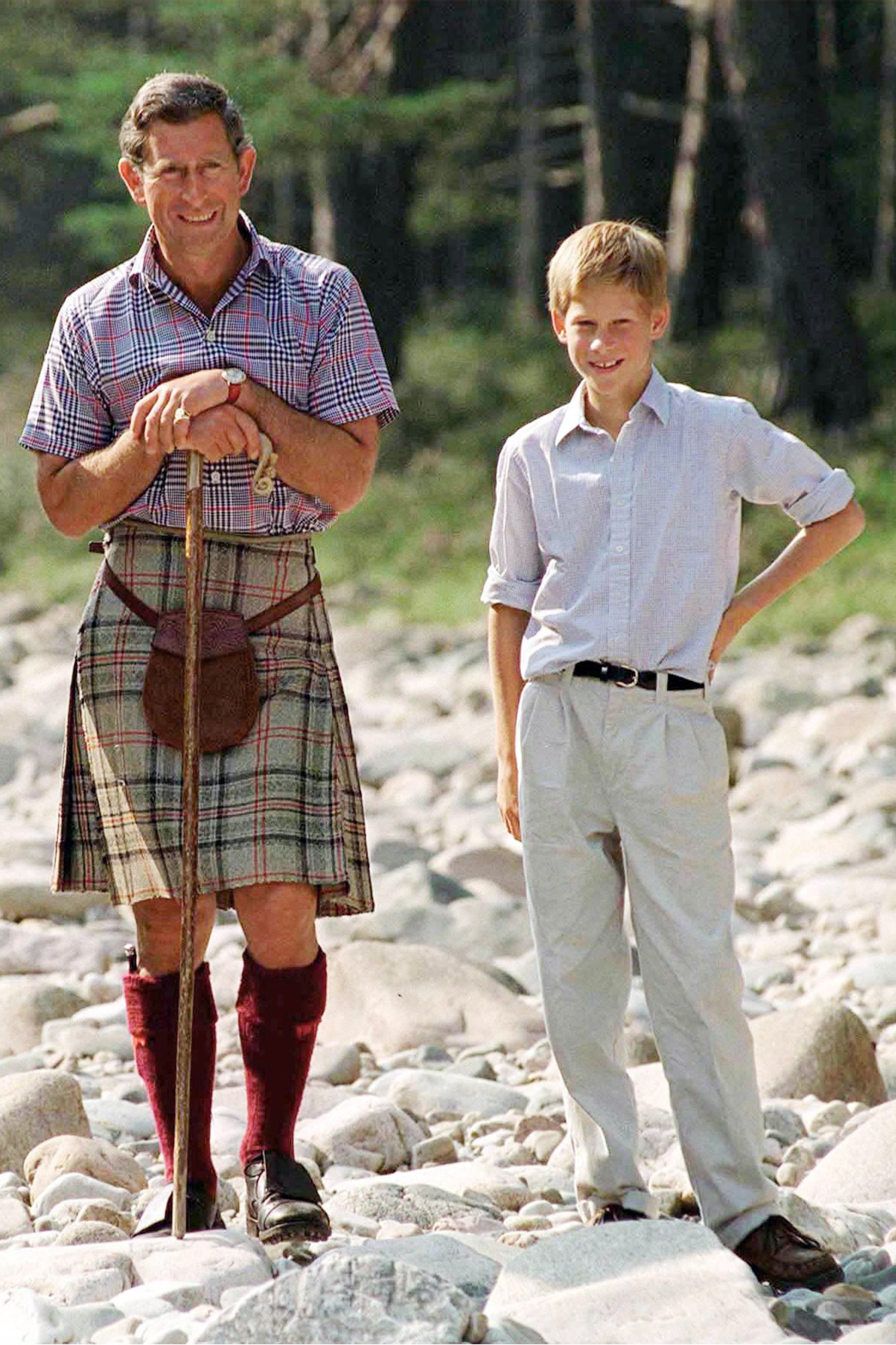 Prince Charles and Prince Harry at Polvier, by the River Dee in Balmoral Castle Estate on August 12 1997. | Source: Getty Images