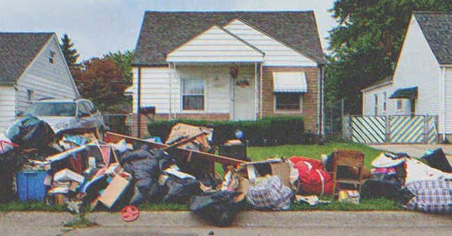 A pile of garbage in front of a house | Source: Shutterstock