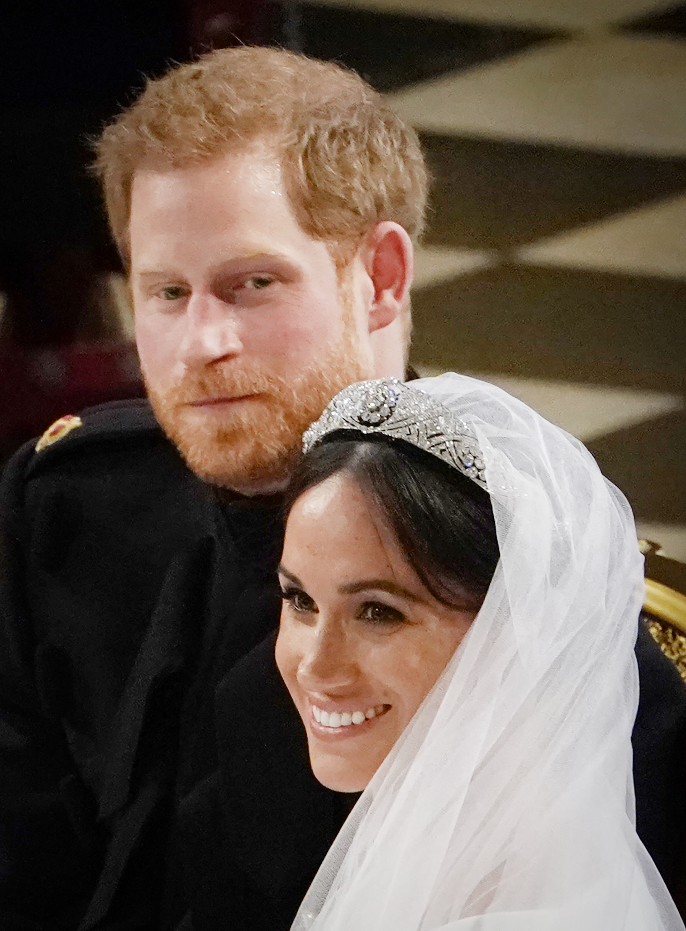 The Duke of Sussex, Prince Harry and Meghan Markle stand at the altar at St George's Chapel in Windsor, England, on May 19, 2018. | Source: Getty Images