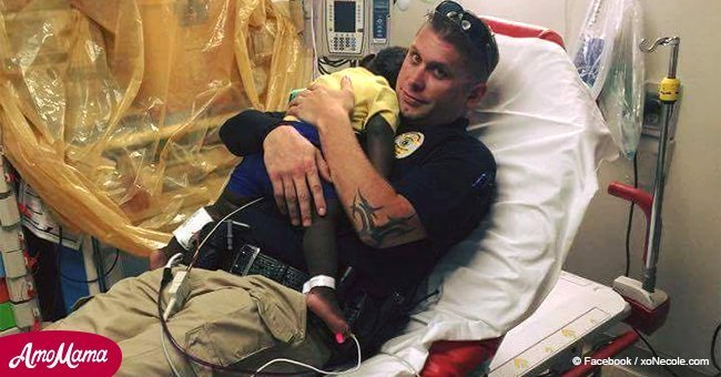 'He needed somebody.' Photo of police officer comforting little boy goes viral