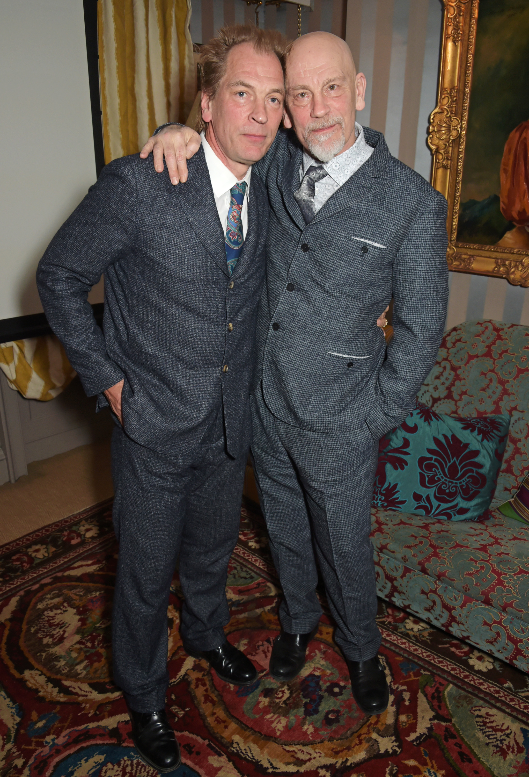Julian Sands and John Malkovich pose at the premiere of "A Postcard From Istanbul," directed by John Malkovich, in collaboration with St. Regis Hotels & Resorts at 5 Hertford Street on March 3, 2015, in London, England | Source: Getty Images