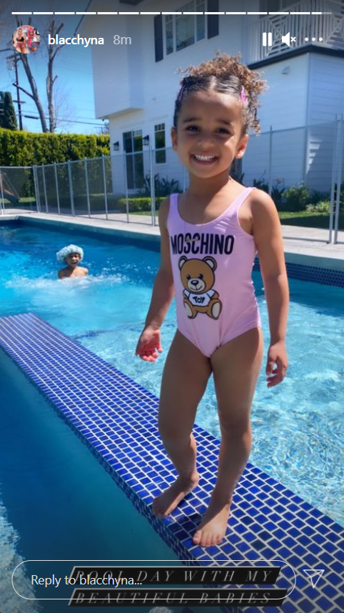 An image of Dream Kardashian posing in a pink swimsuit | Photo: Instagram.com/blacchyna