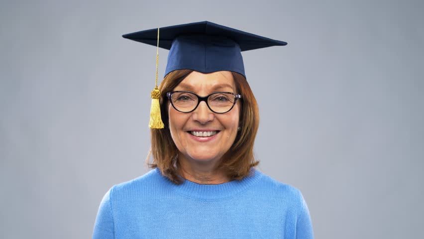 Elderly woman wearing graduation cap | Photo: Shutterstock
