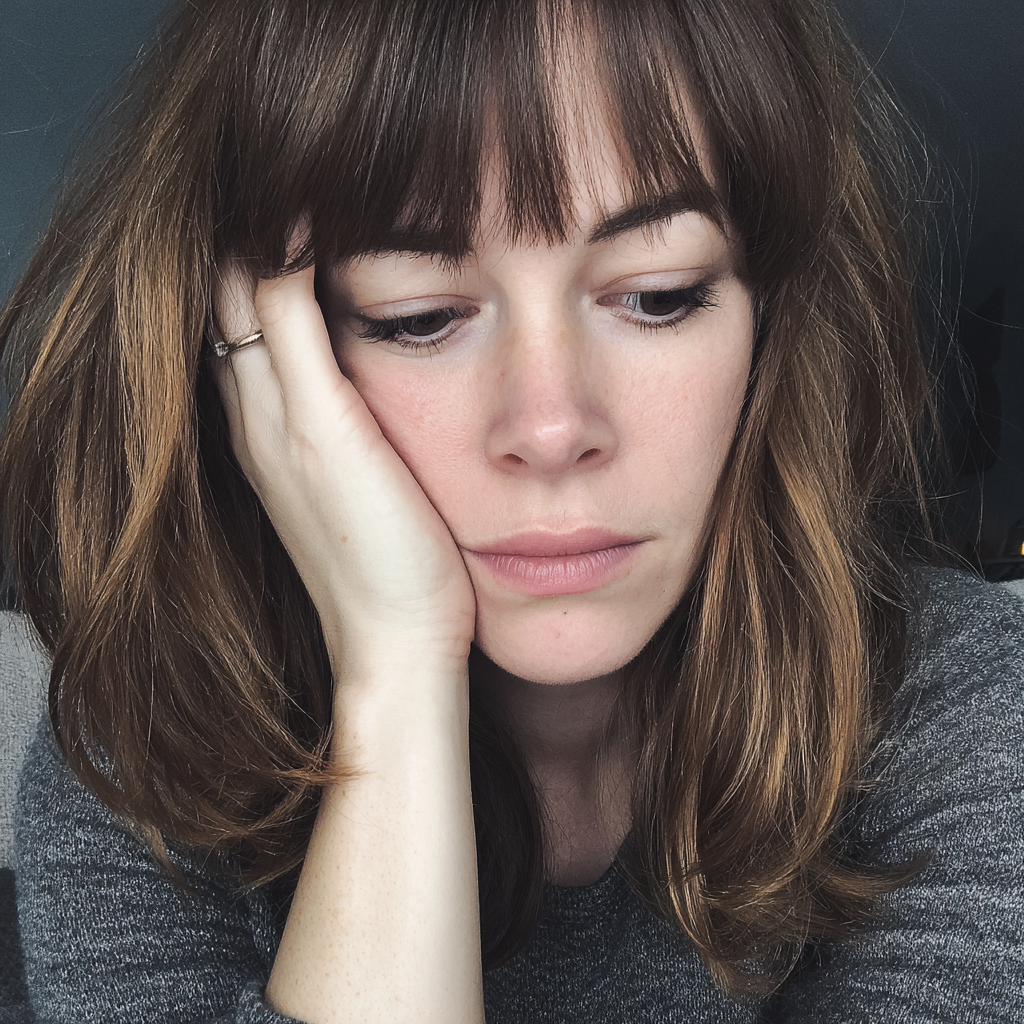 A close-up of an exhausted woman | Source: Midjourney
