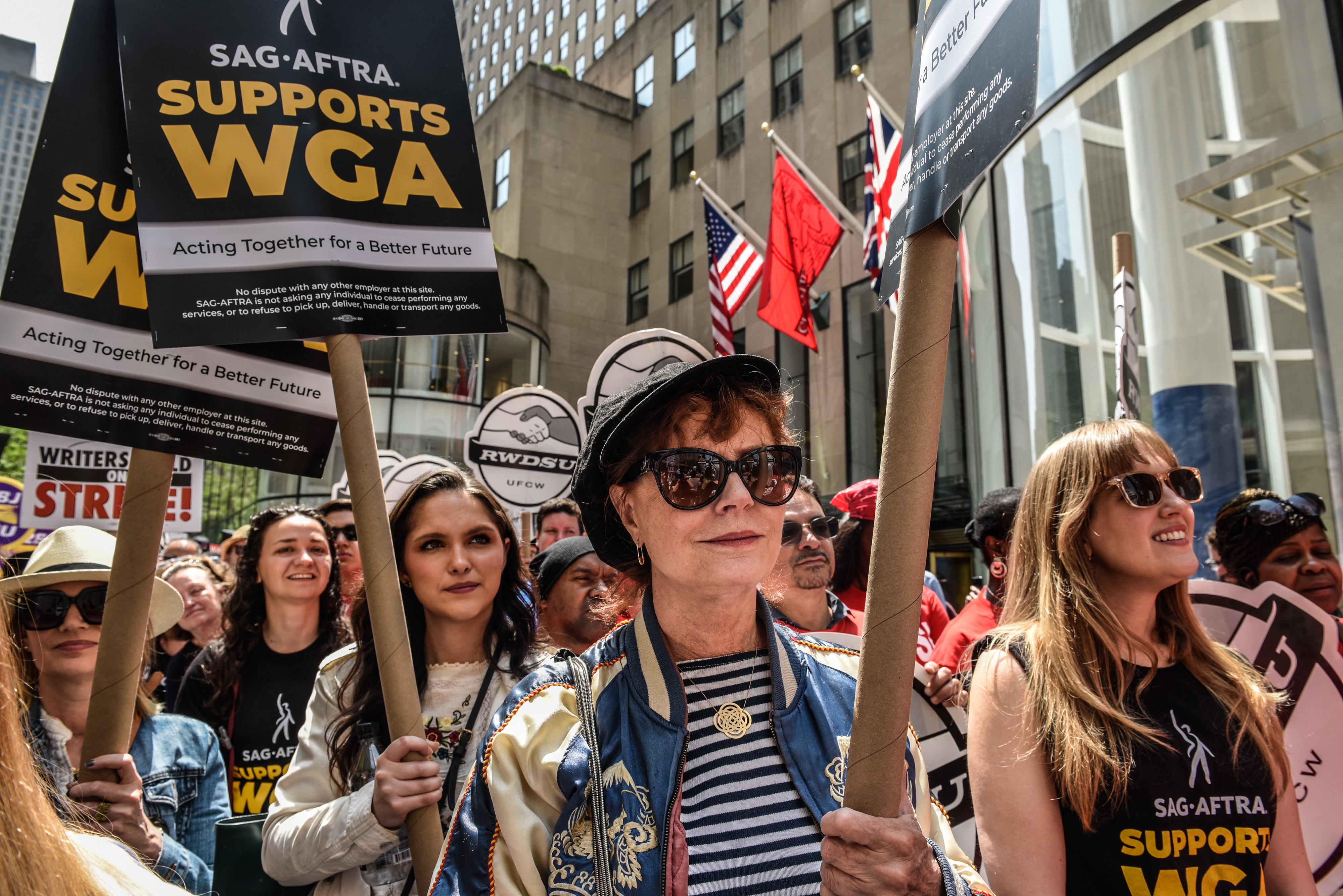 Susan Sarandon, center, with Writers Guild of America members and supporters on a picket line at 30 Rockefeller Plaza in New York on Tuesday, May 23, 2023. | Source:  Getty Images