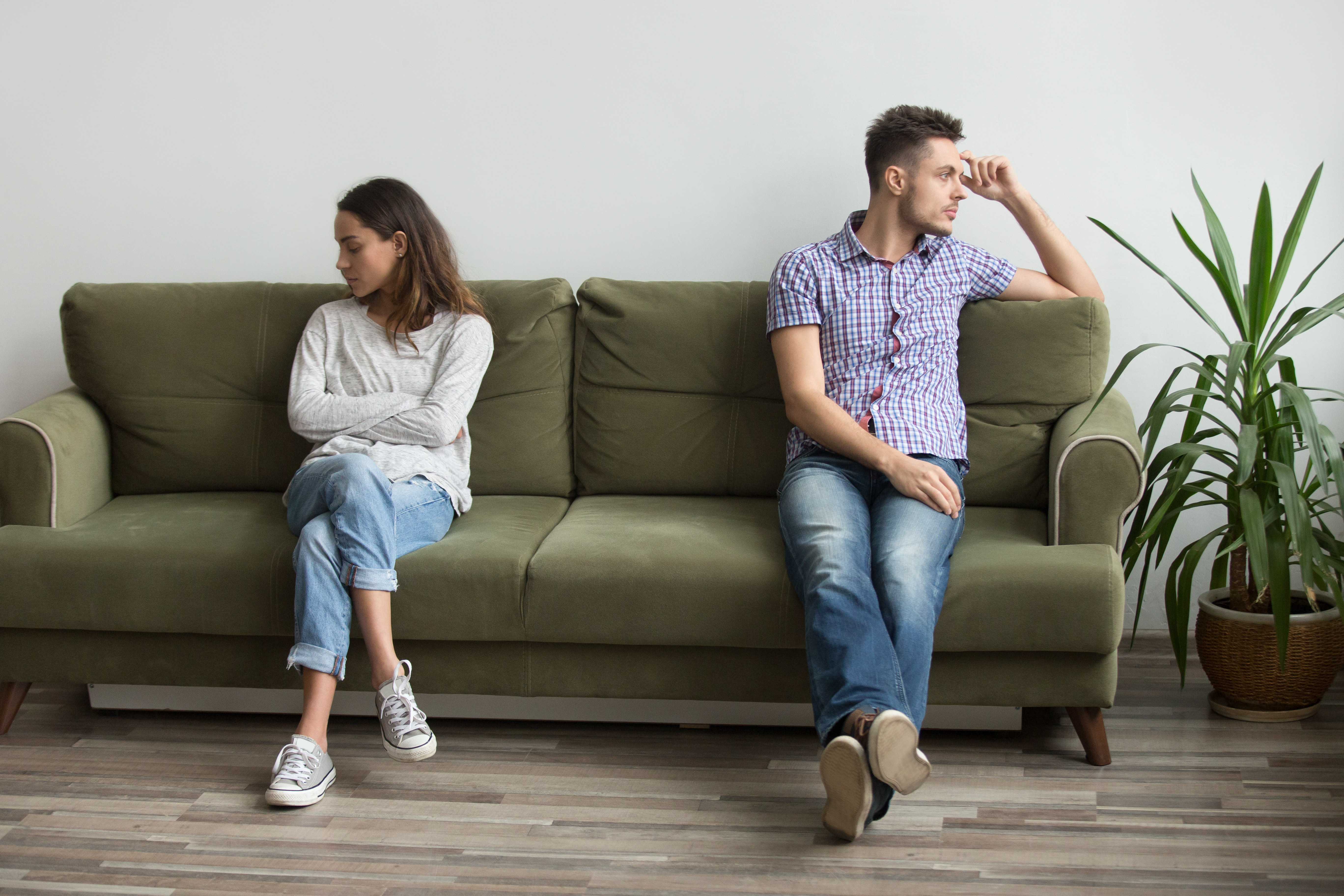 A sad couple not talking to each other | Source: Shutterstock