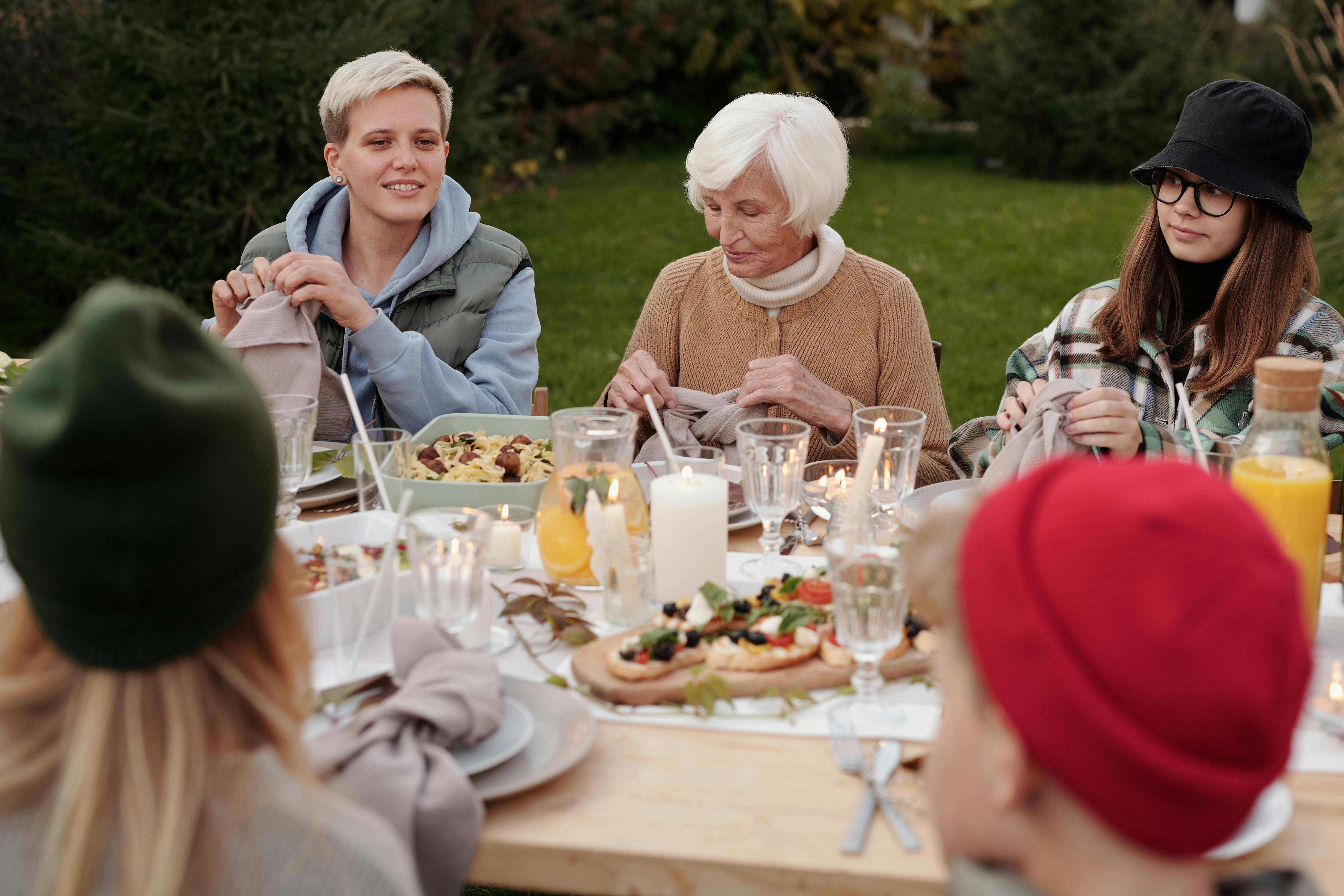 Family members gathered for a meal | Source: Pexels
