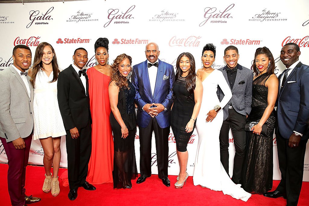 Steve and Marjorie Harvey with their children and their spouses at the Steve & Marjorie Harvey Foundation Gala, May 2014 | Photo: Getty Images