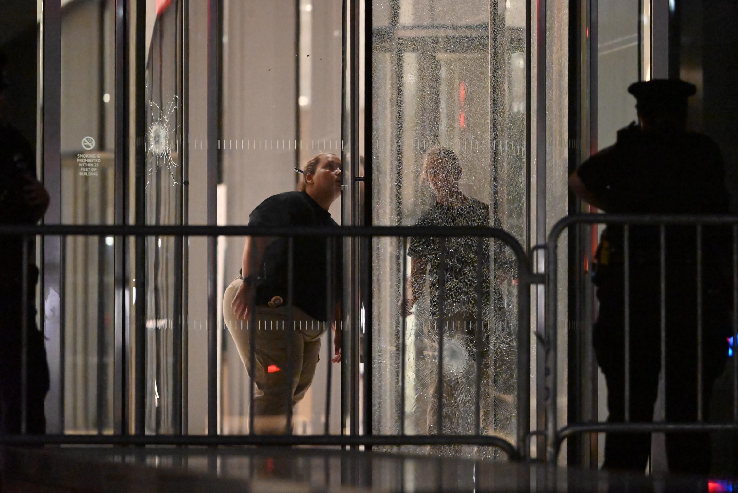 Members of the NYPD crime scene unit place down evidence markers inside of the lobby area, at 345 Park Avenue following the mass shooting attack in Manhattan, New York, on July 29, 2025 | Source: Getty Images