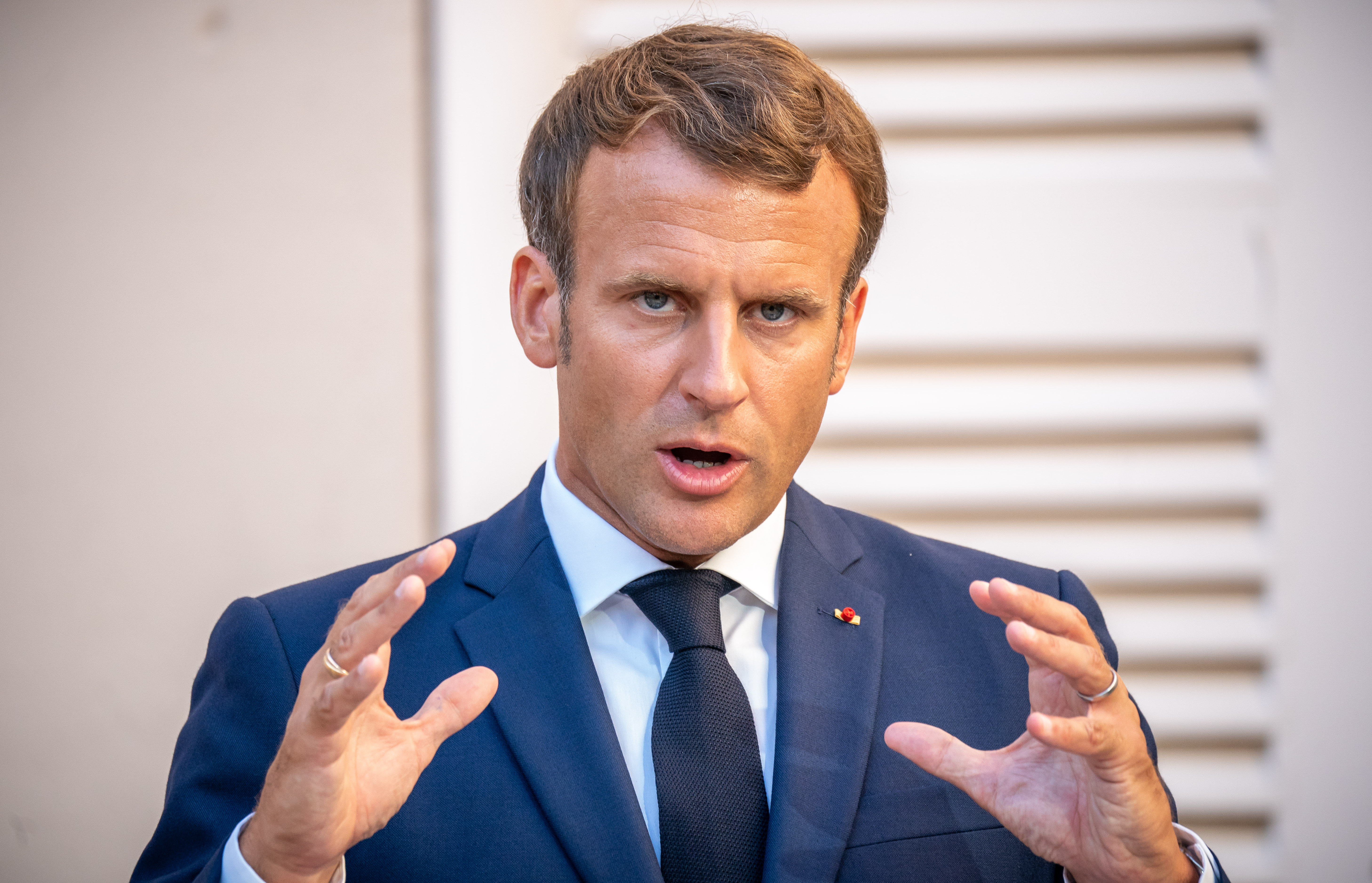 Emmanuel Macron speaks at a press conference with Chancellor Merkel at the presidential summer residence in Fort de Bregancon on August 20, 2020 | Source: Getty Images