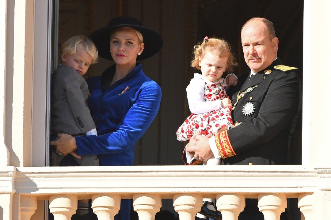  Princess Charlene of Monaco with Prince Jacques of Monaco and Prince Albert II of Monaco with Princess Gabriella of Monaco greet the crowd from the palace's balcony during the Monaco National Day Celebrations on November 19, 2017 | Source: Getty Images