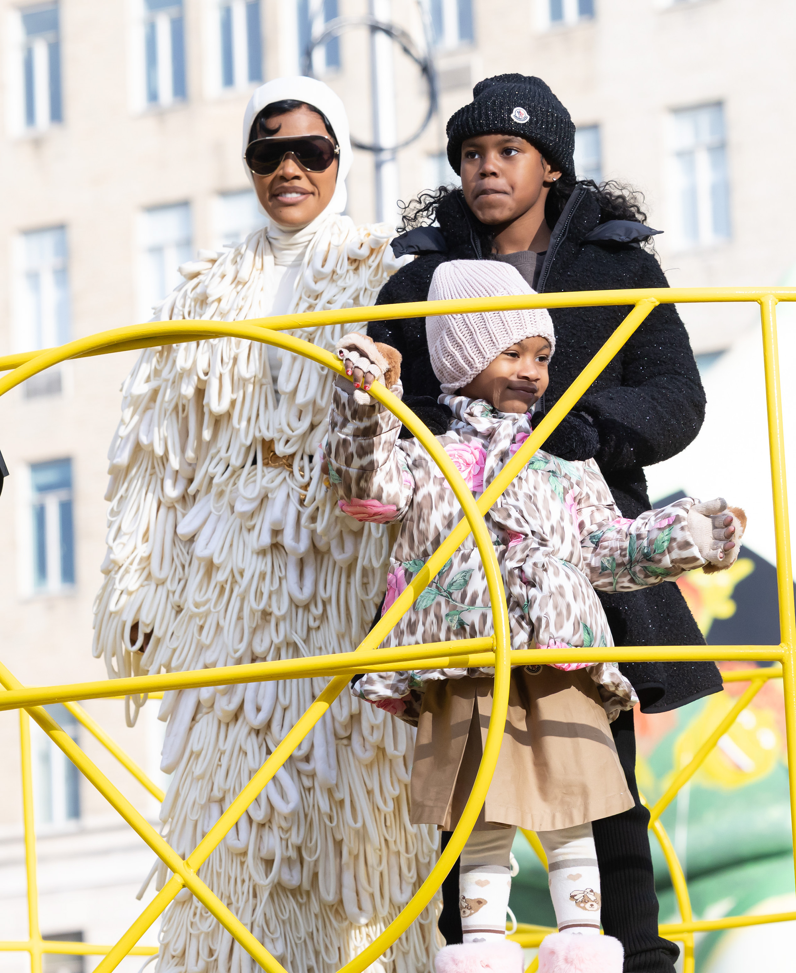 Teyana Taylor is seen with daughters Iman "Junie" Tayla Shumpert Jr. and Rue Rose Shumpert at the 99th Macy's Thanksgiving Day Parade on November 27, 2025, in New York City | Source: Getty Images