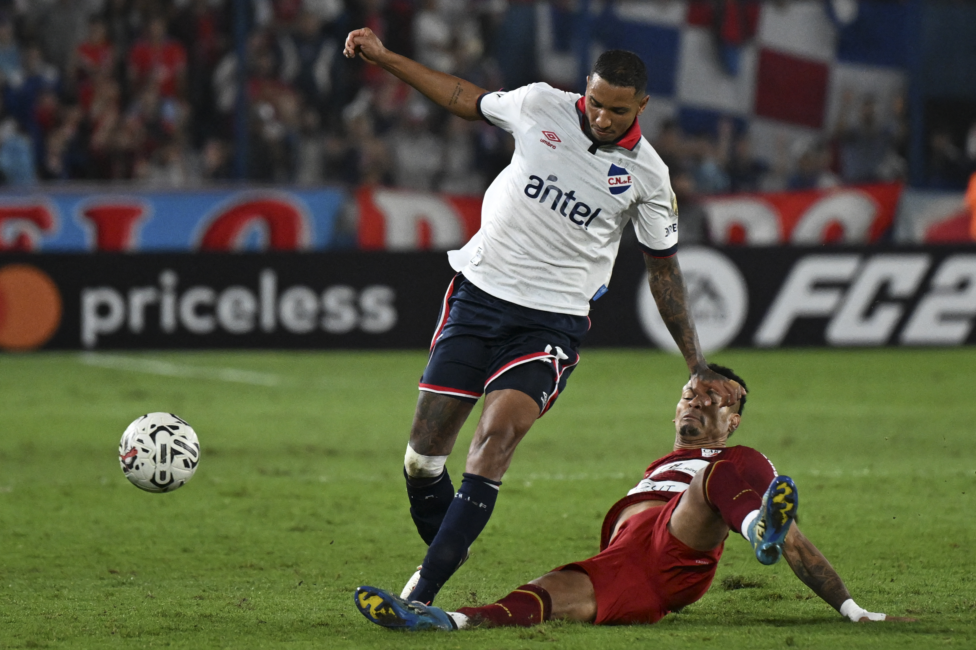 Juan Manuel Izquierdo fights for the ball during the Copa Libertadores football match between Uruguay's Nacional and Bolivia's Always Ready in Montevideo, on March 14, 2024 | Source: Getty Images