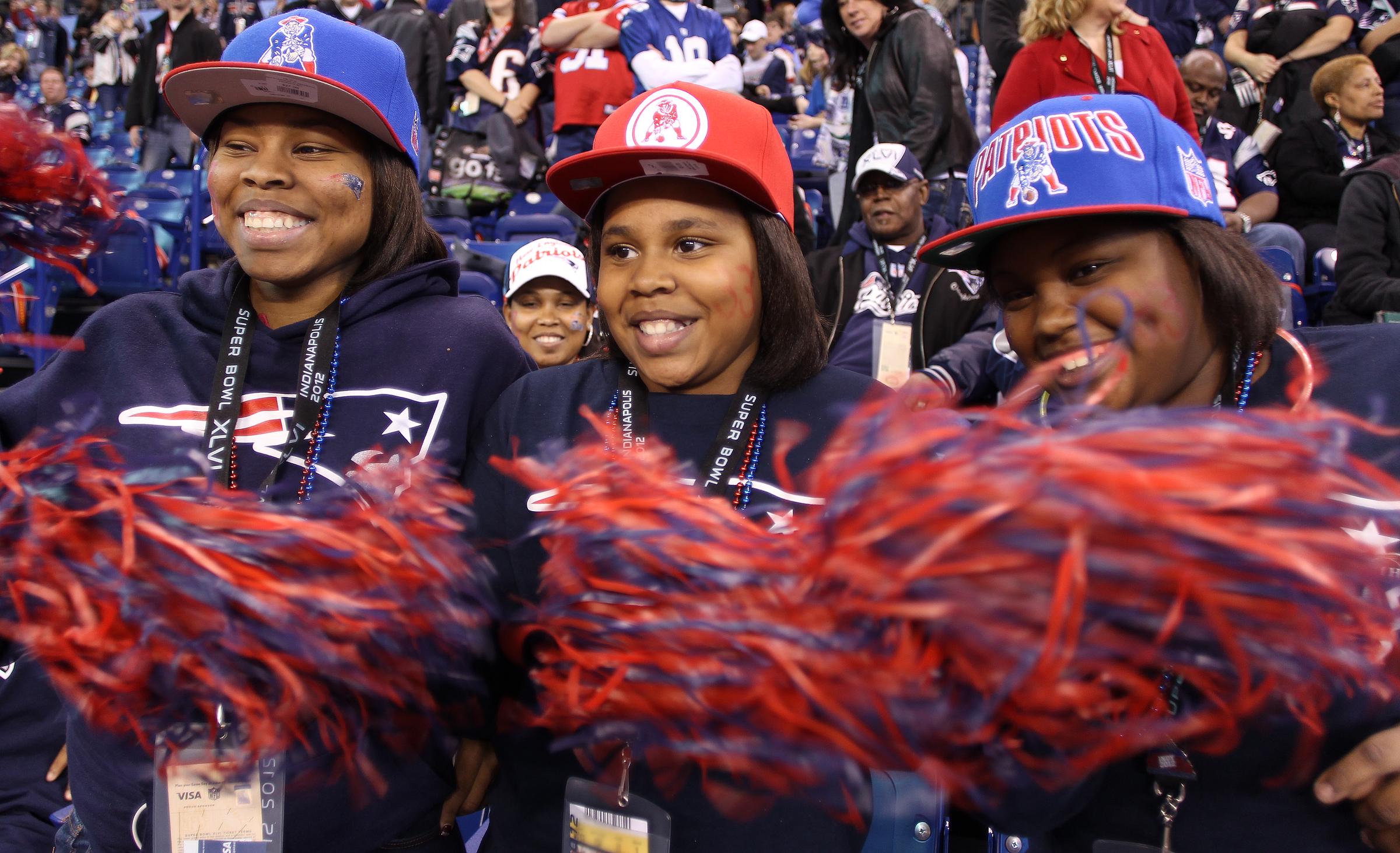 Kevin Faulk's daughters from left to right: Tanasha, Kevione, and Tionne Faulk before the start of Super Bowl XLVI at Lucas Oil Stadium in Indianapolis on February 5, 2012 | Source: Getty Images