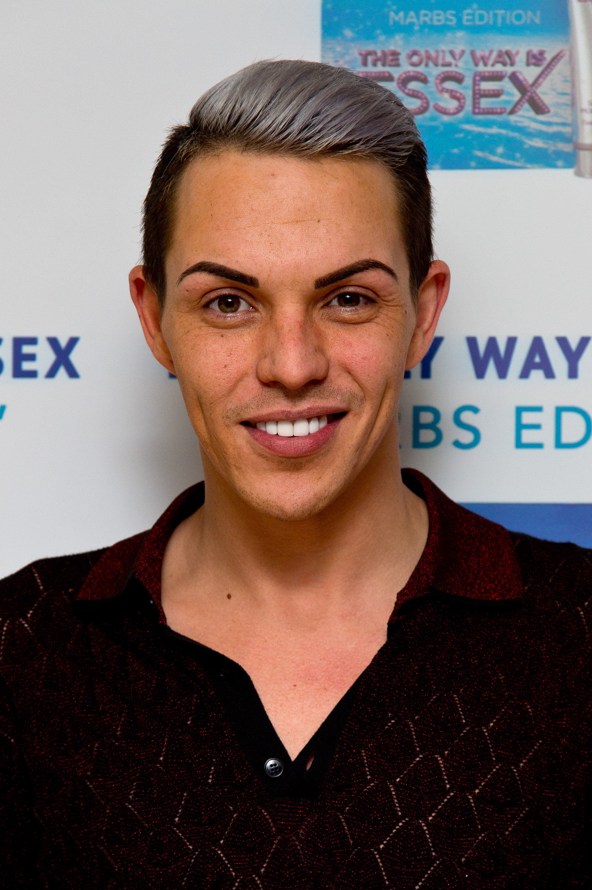 At the "Towie" Marbs fragrance launch in May 2015, Norris turned heads with a bold two-toned hairstyle — silver at the top, dark at the roots — paired with a deep burgundy textured top.