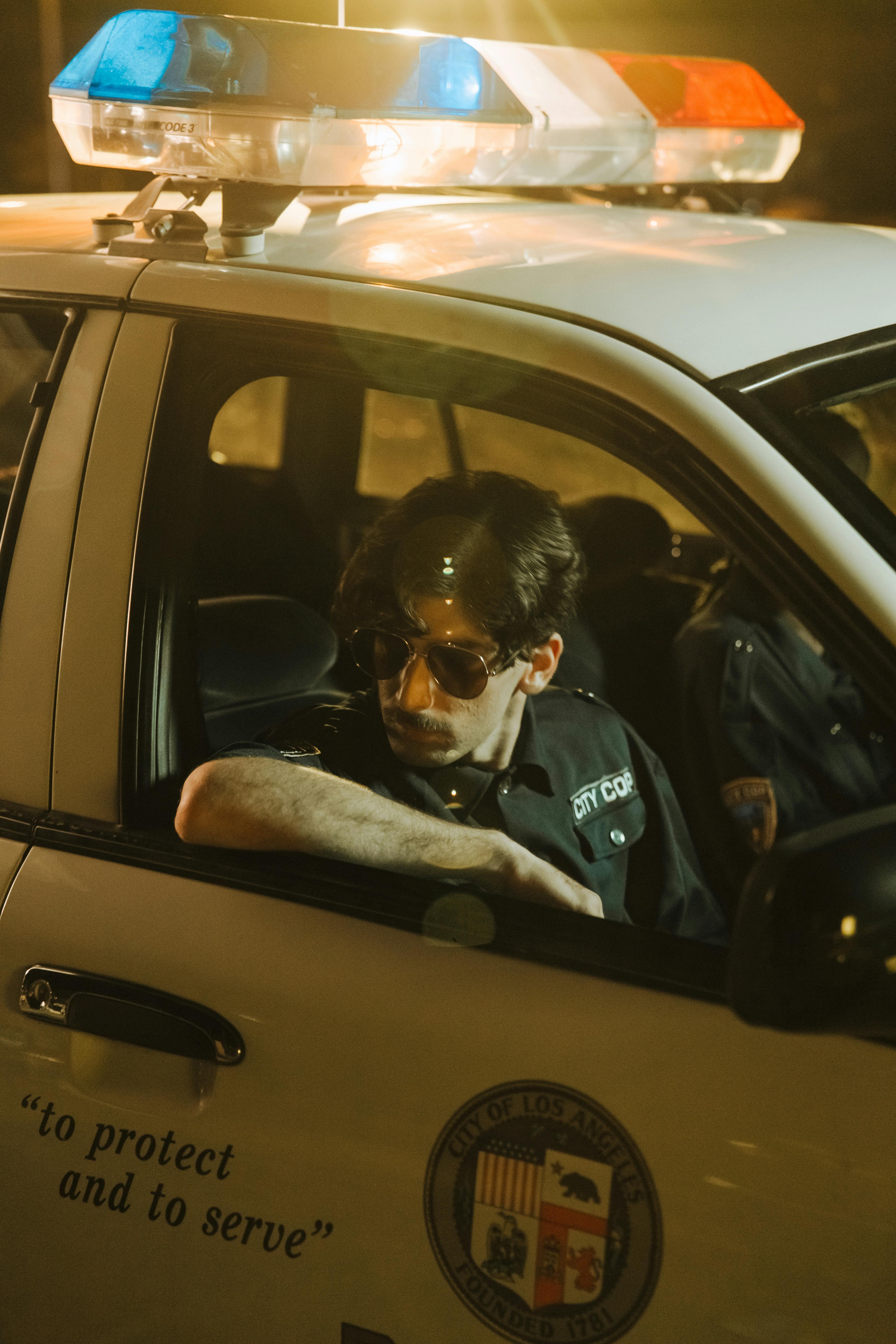 A policeman in his car | Source: Pexels