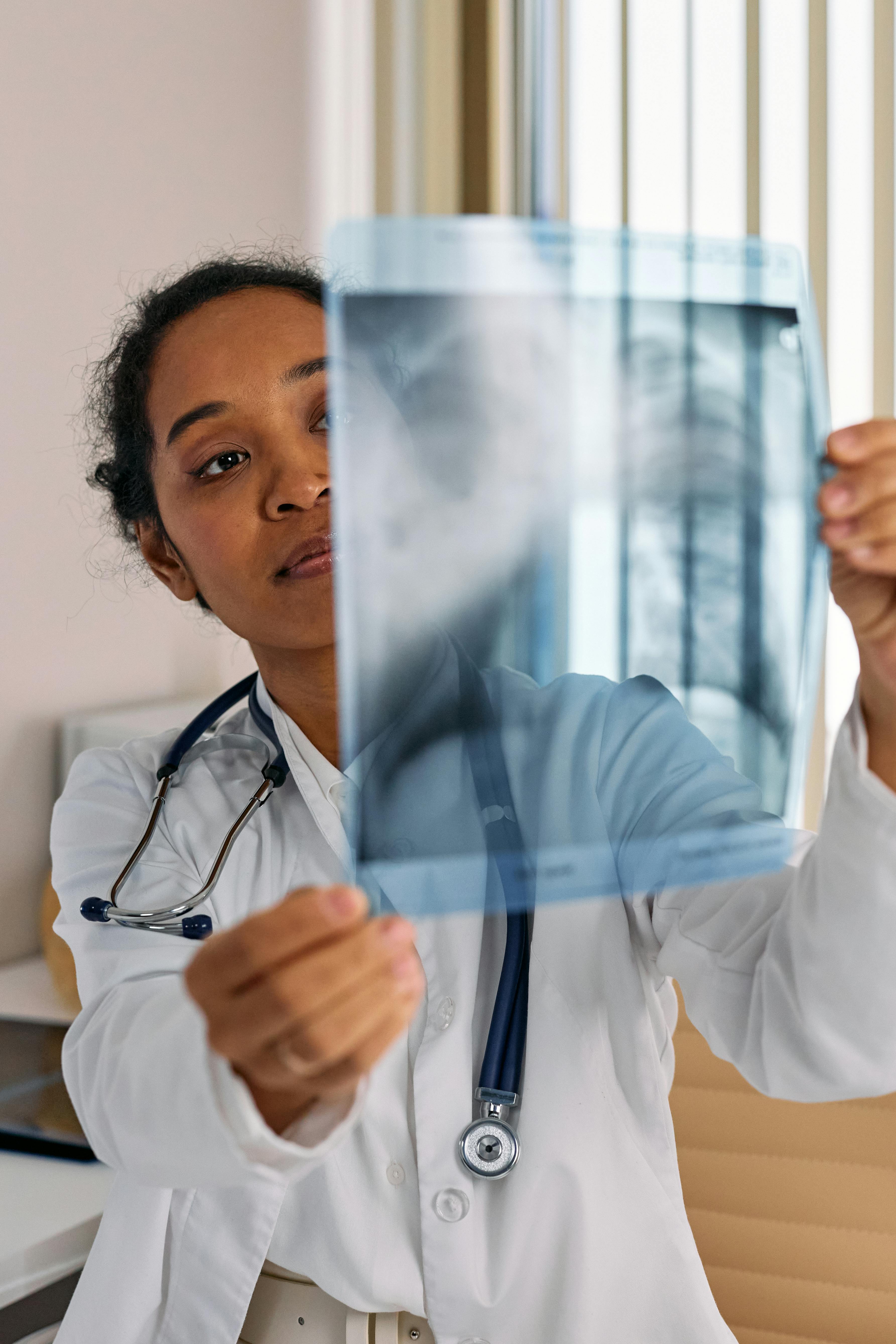 A doctor checking x-ray results | Source: Pexels