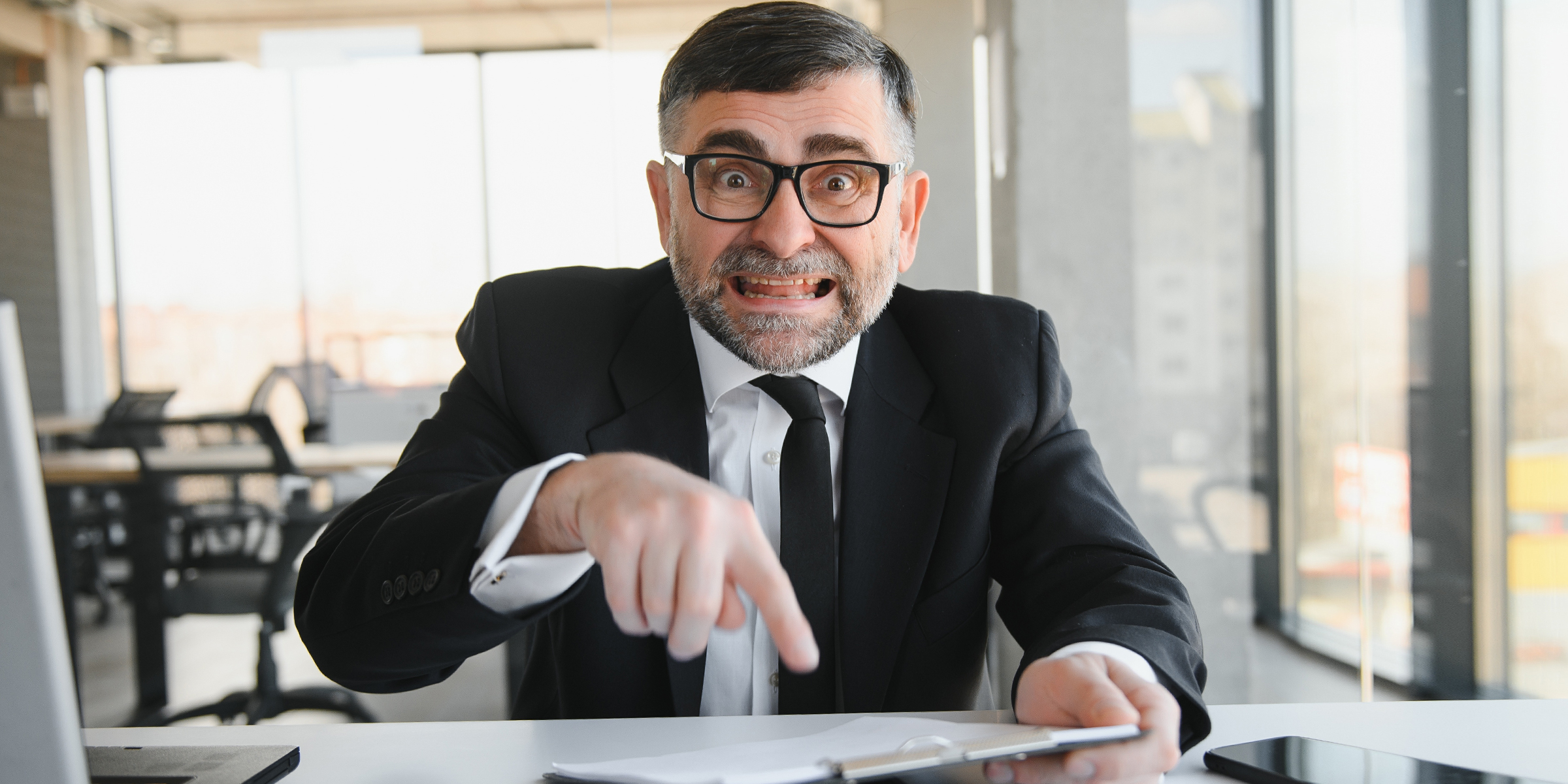 An angry boss in his office | Source: Shutterstock