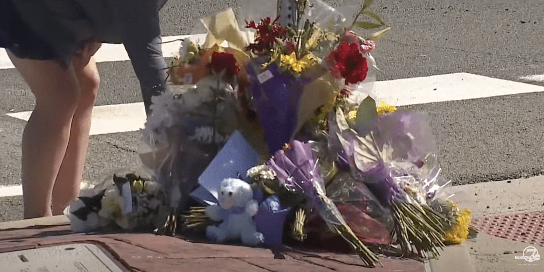 People leave flowers, stuffed toys, and touching notes for Austin in the median. | Source: YouTube.com/Denver 7 — The Denver Channel