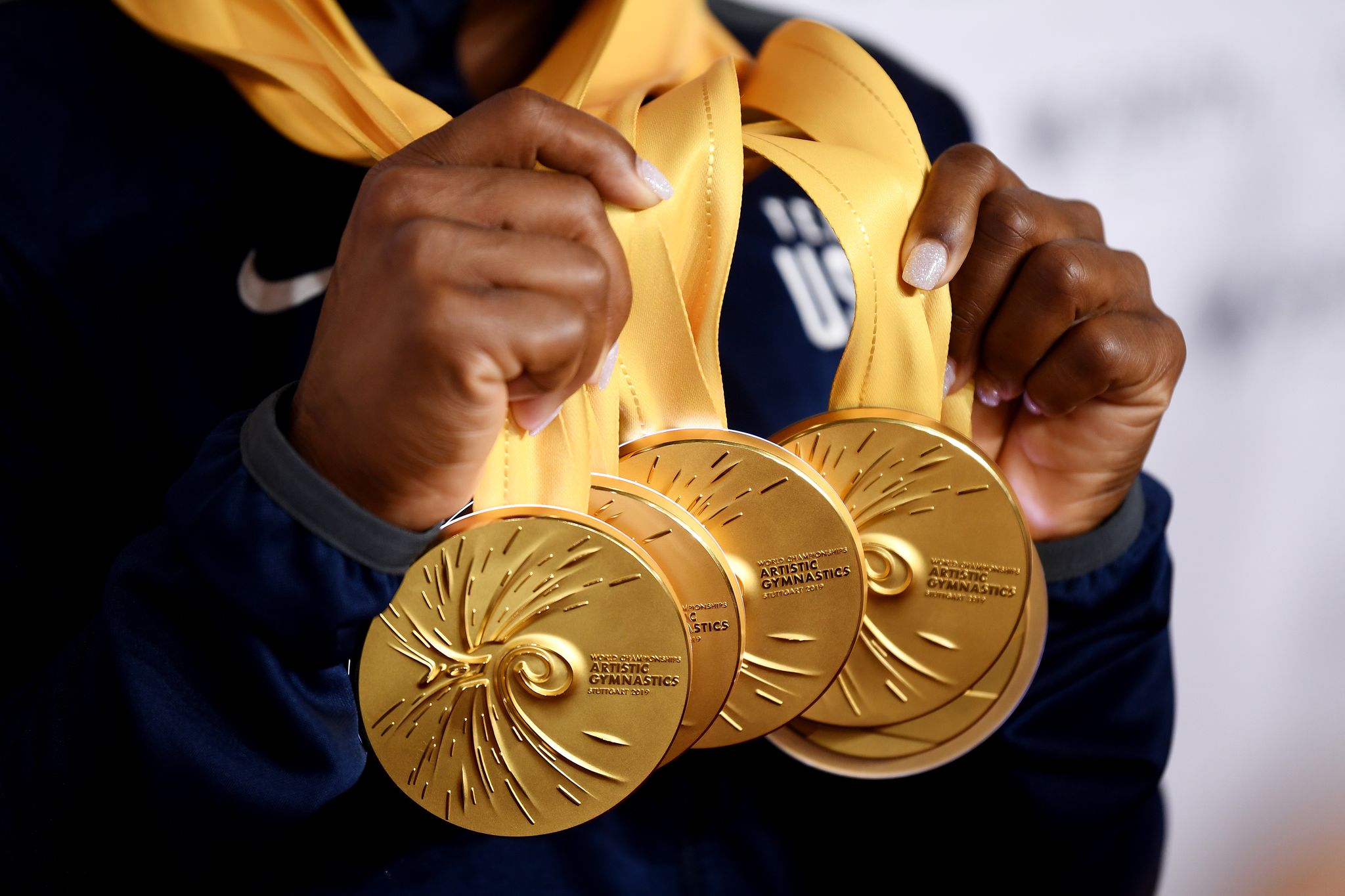 Gold medals on a person. | Source: Shutterstock