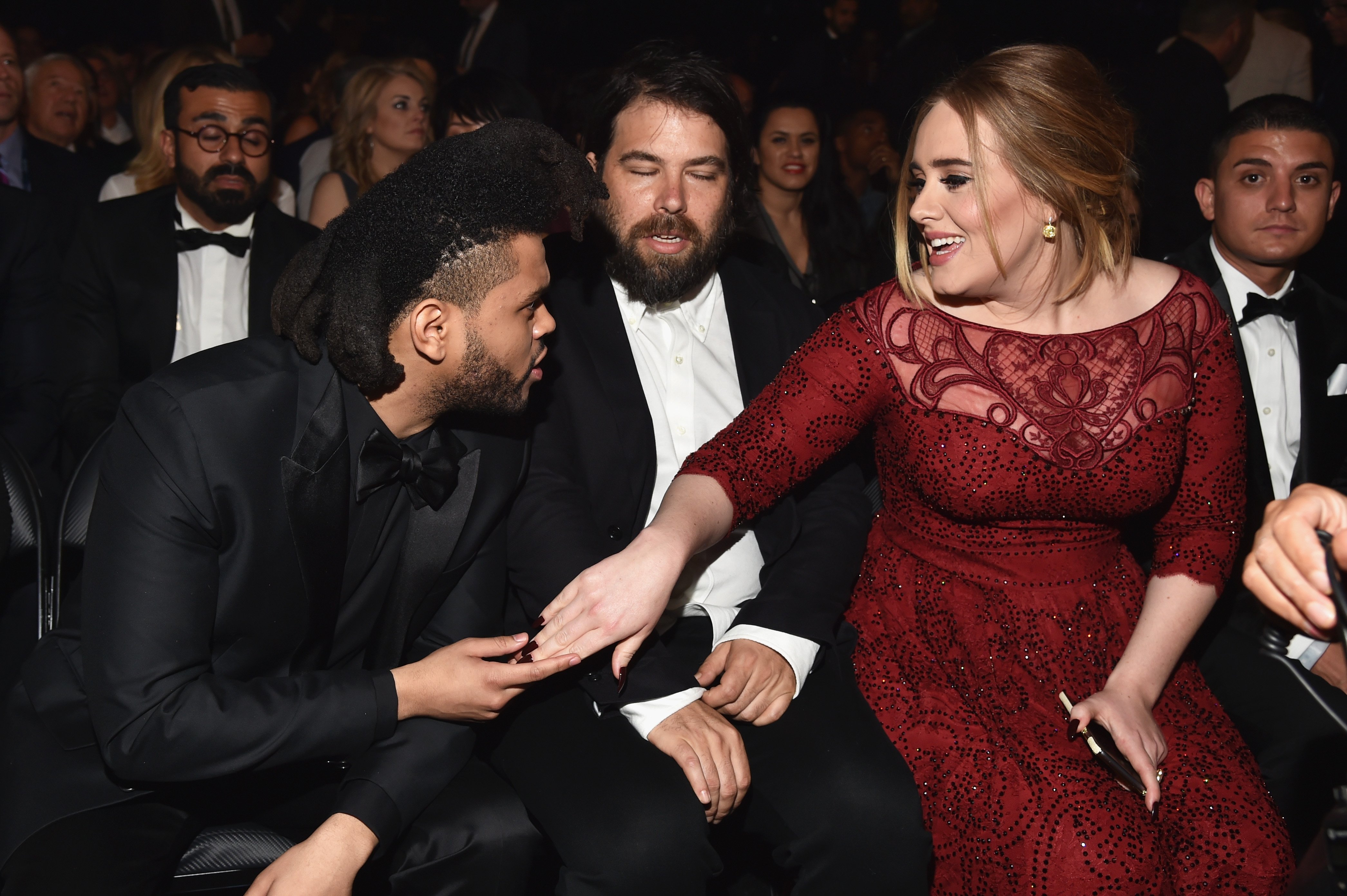 Singer The Weeknd, Simon Konecki and singer-songwriter Adele during The 58th GRAMMY Awards at Staples Center on February 15, 2016, in Los Angeles, California. | Source: Getty Images