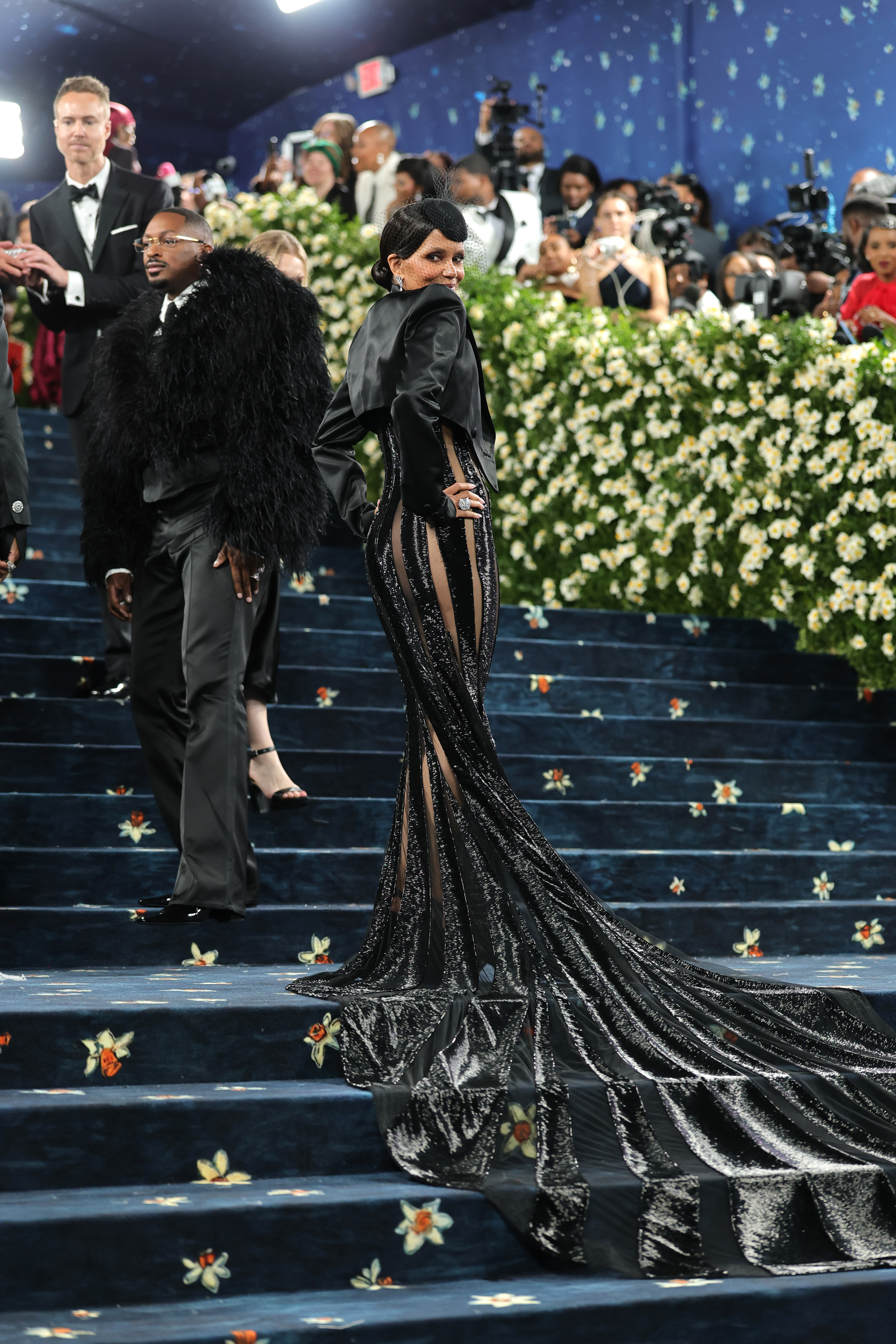 Halle Berry poses on the Met steps during her appearance on the event, dated May 5, 2025, in New York | Source: Getty Images