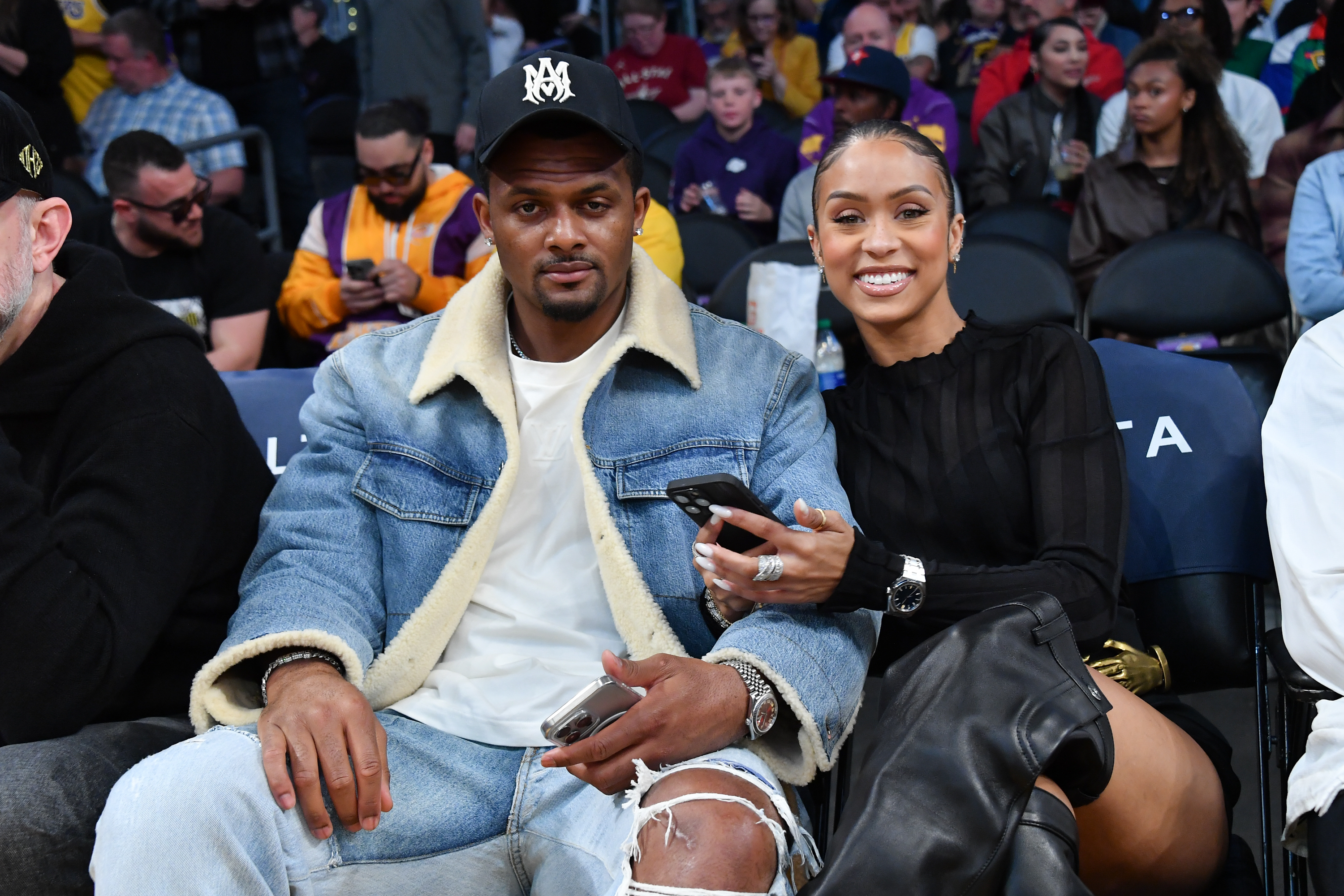 Deshaun Watson and Jilly Anais at a game between the Los Angeles Lakers and the Minnesota Timberwolves in Los Angeles, California on April 7, 2024. | Source: Getty Images