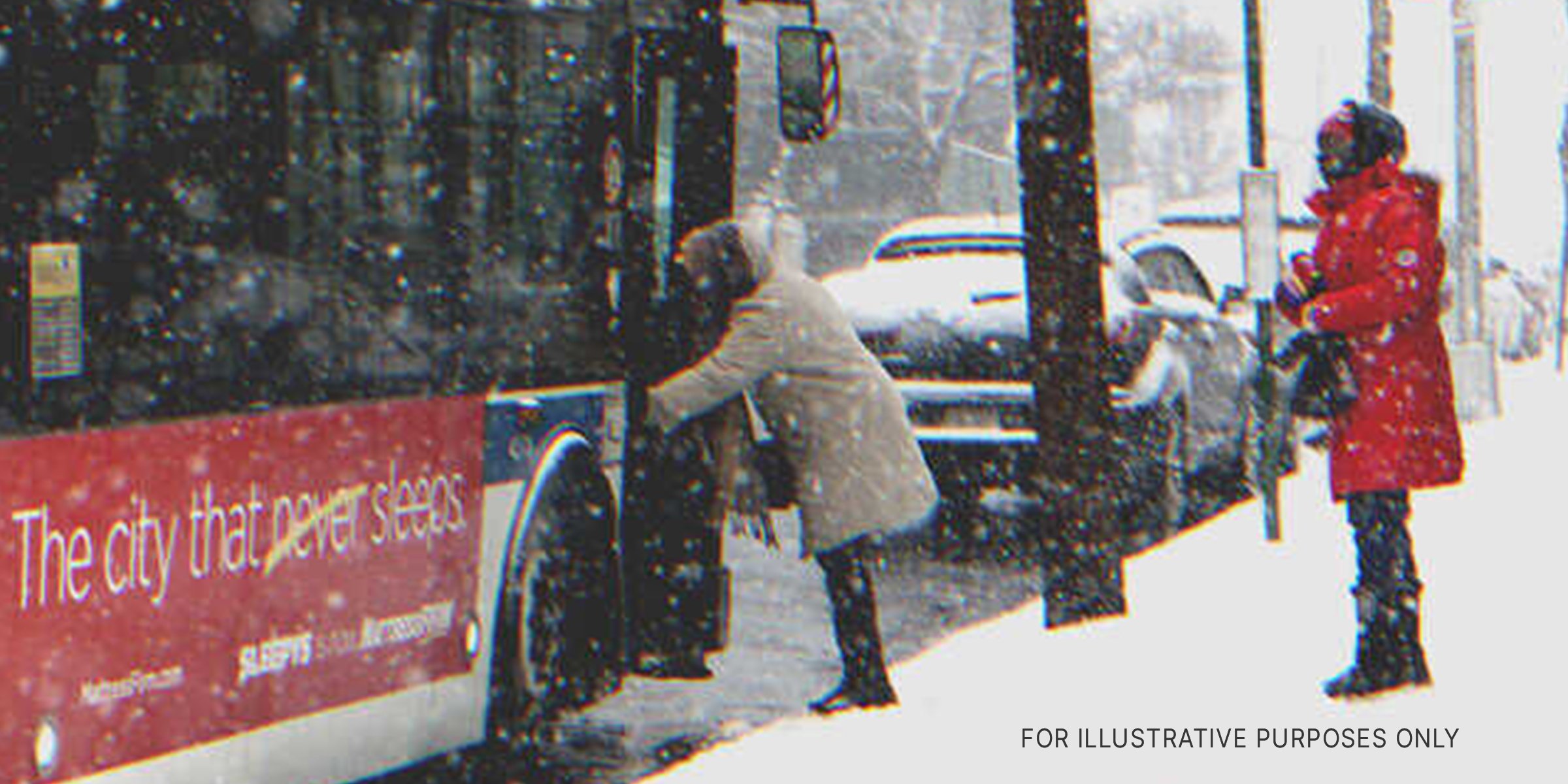Two people stand in the snow beside a bus | Source: Shutterstock