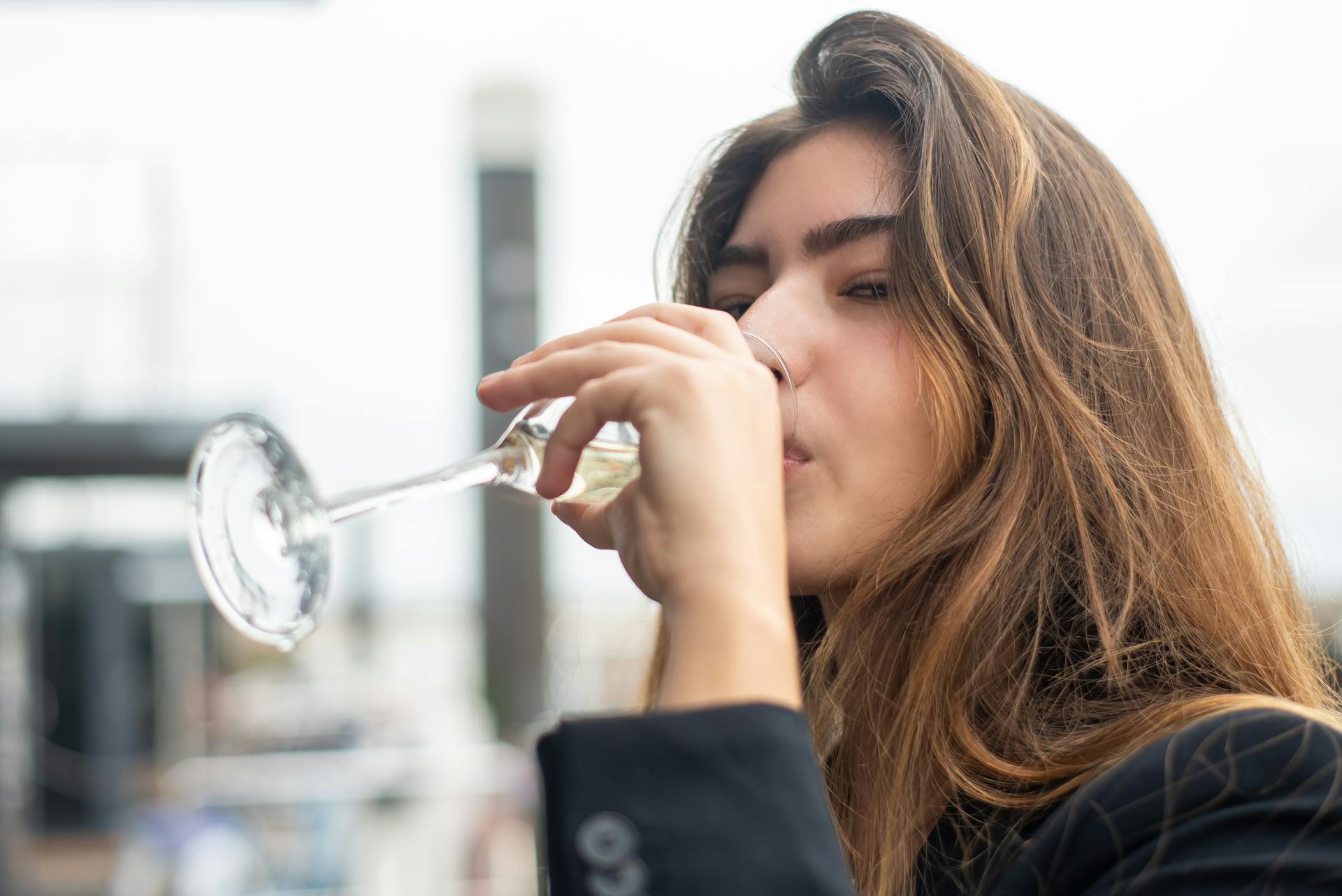 A woman drinking a glass of wine | Source: Pexels