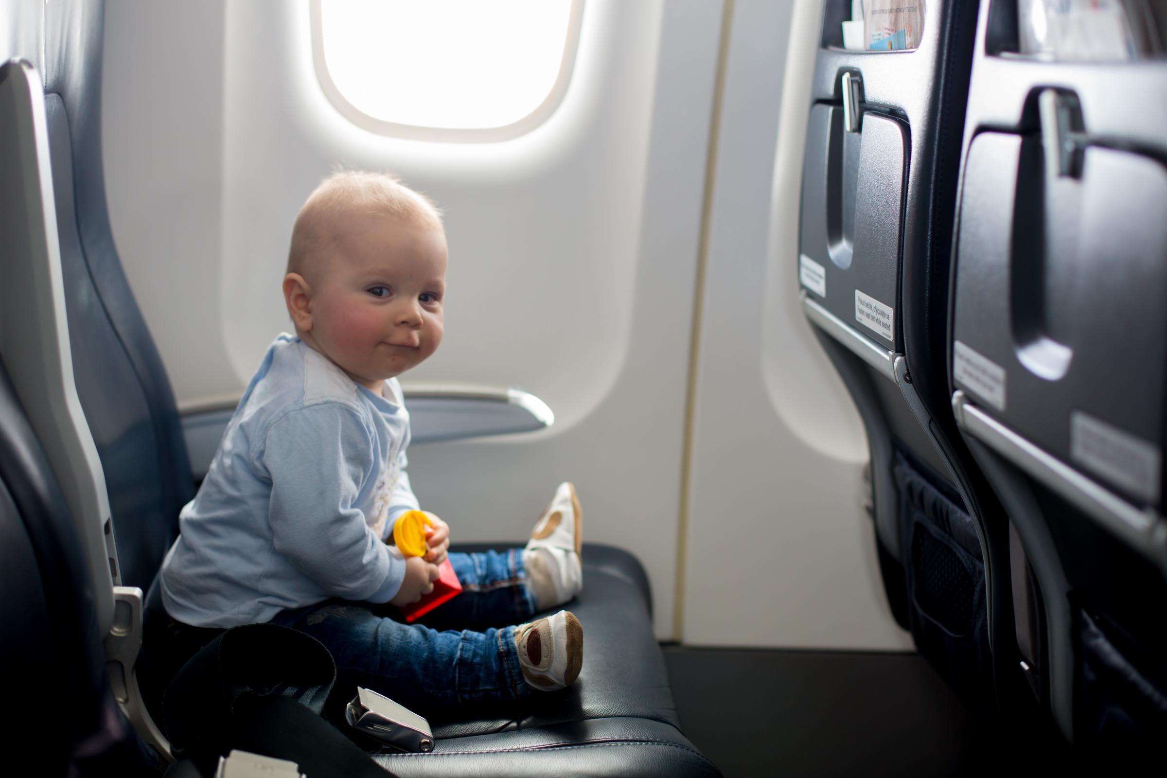 Baby inside a plane | Source: Shutterstock