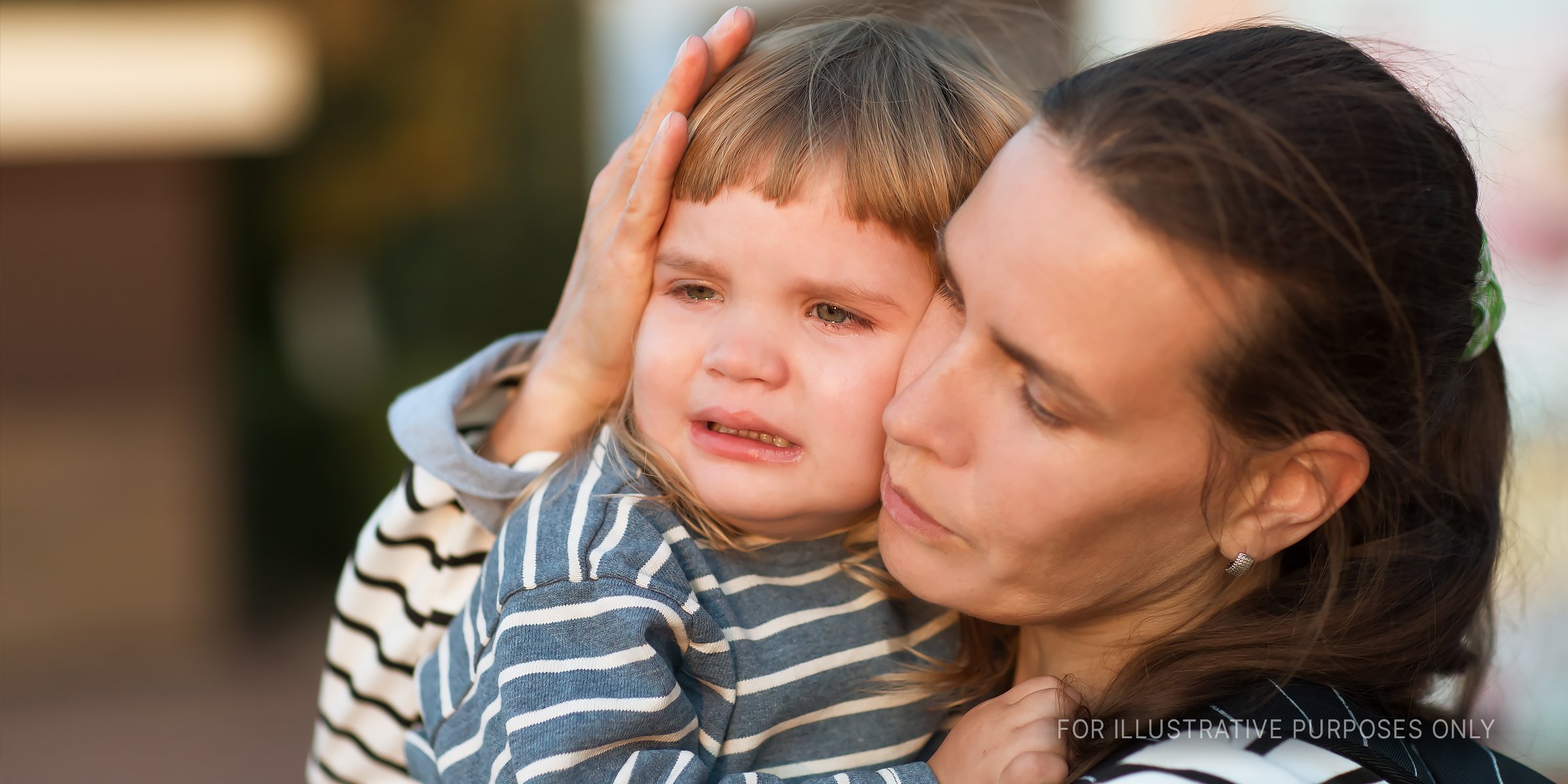 Woman Consoling A Crying Child. | Source: Shutterstock
