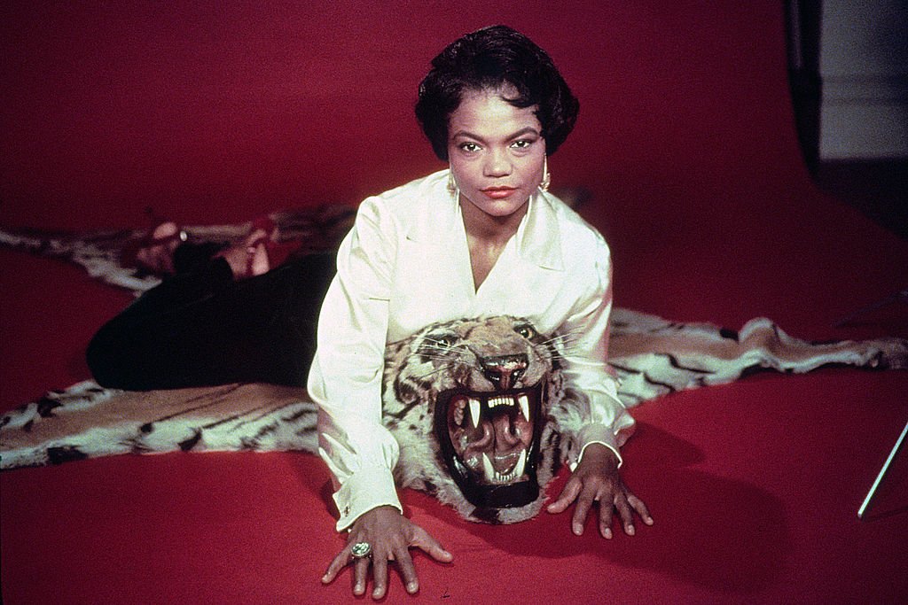 An undated picture of Hollywood star, Eartha Kitt striking a pose on top of leopard skin | Photo: Getty  Images