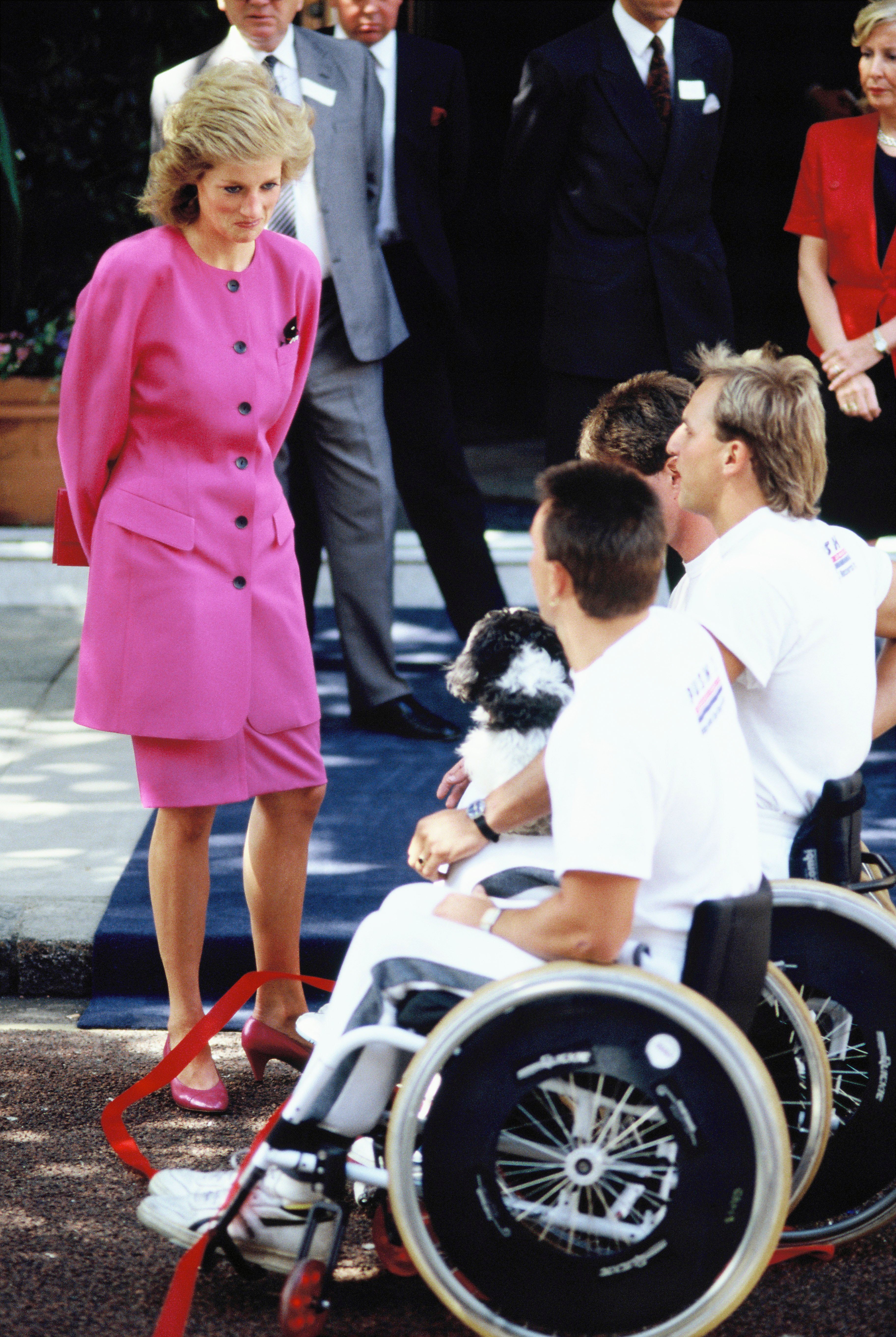 Diana, Princess of Wales, visits people in wheelchairs in 1988. | Source: Getty Images.