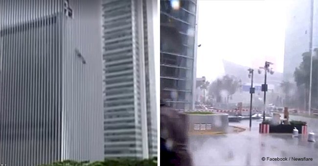 Reporter stood next to a skyscraper just as a huge pane of glass fell from it