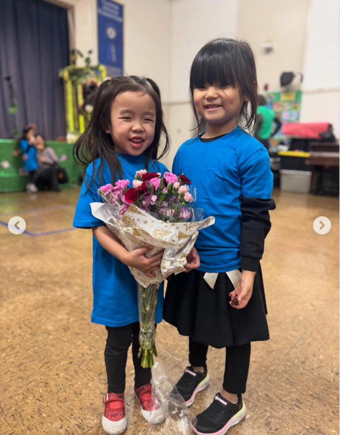 Everest stands beside a friend, both in matching blue tops, from a Alex's post dated December 13, 2025. | Source: Instagram/xtinahuong