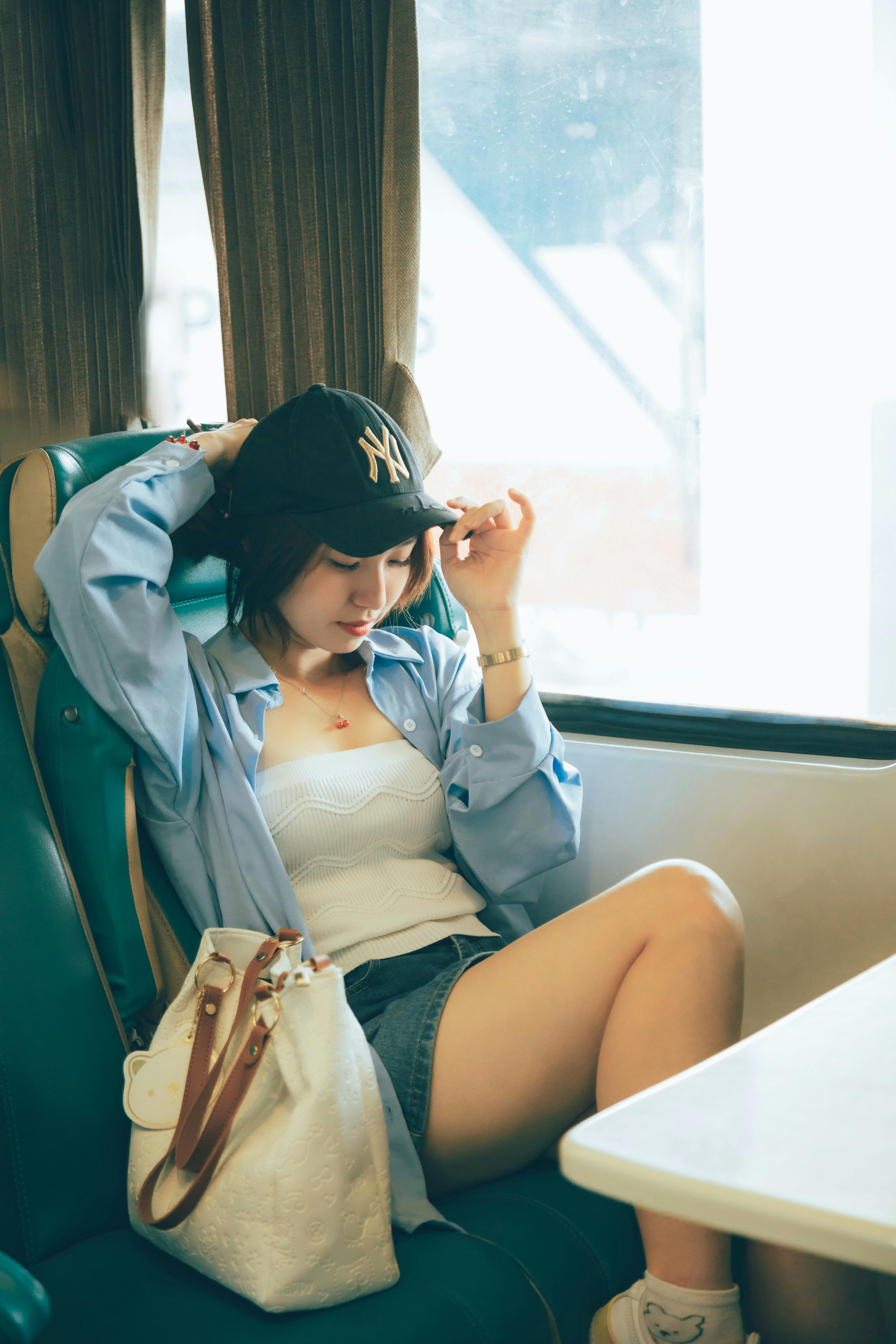 A woman sitting on the subway | Source: Pexels