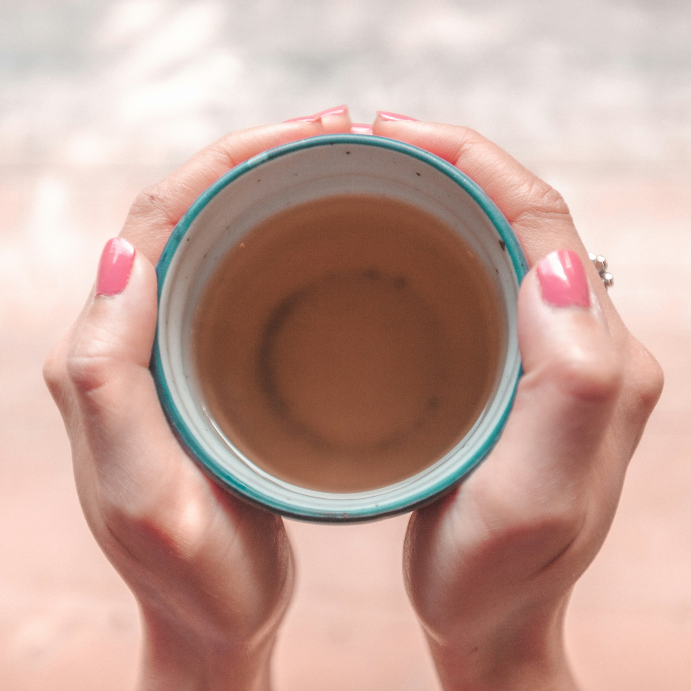 A person holding a cup of tea | Source: Unsplash
