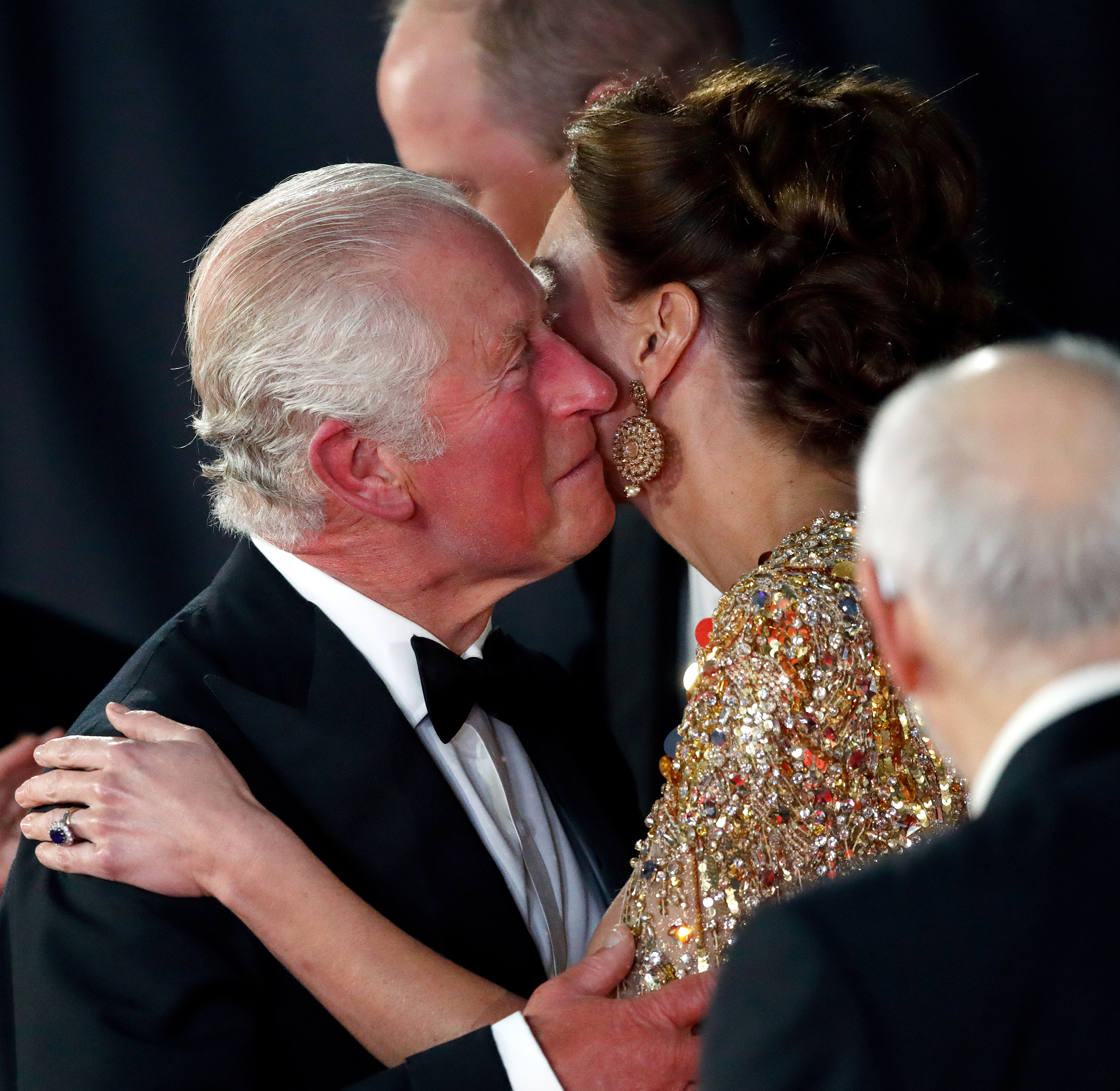 King Charles III kissing the Princess of Wales at the ""No Time To Die" World Premiere " in London in 2021 | Source: Getty Images