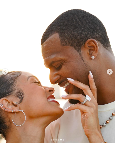 Jilly Anais smiling and lovingly stroking Deshaun Watson's face as they look at each other. | Source: Instagram/jillyanais