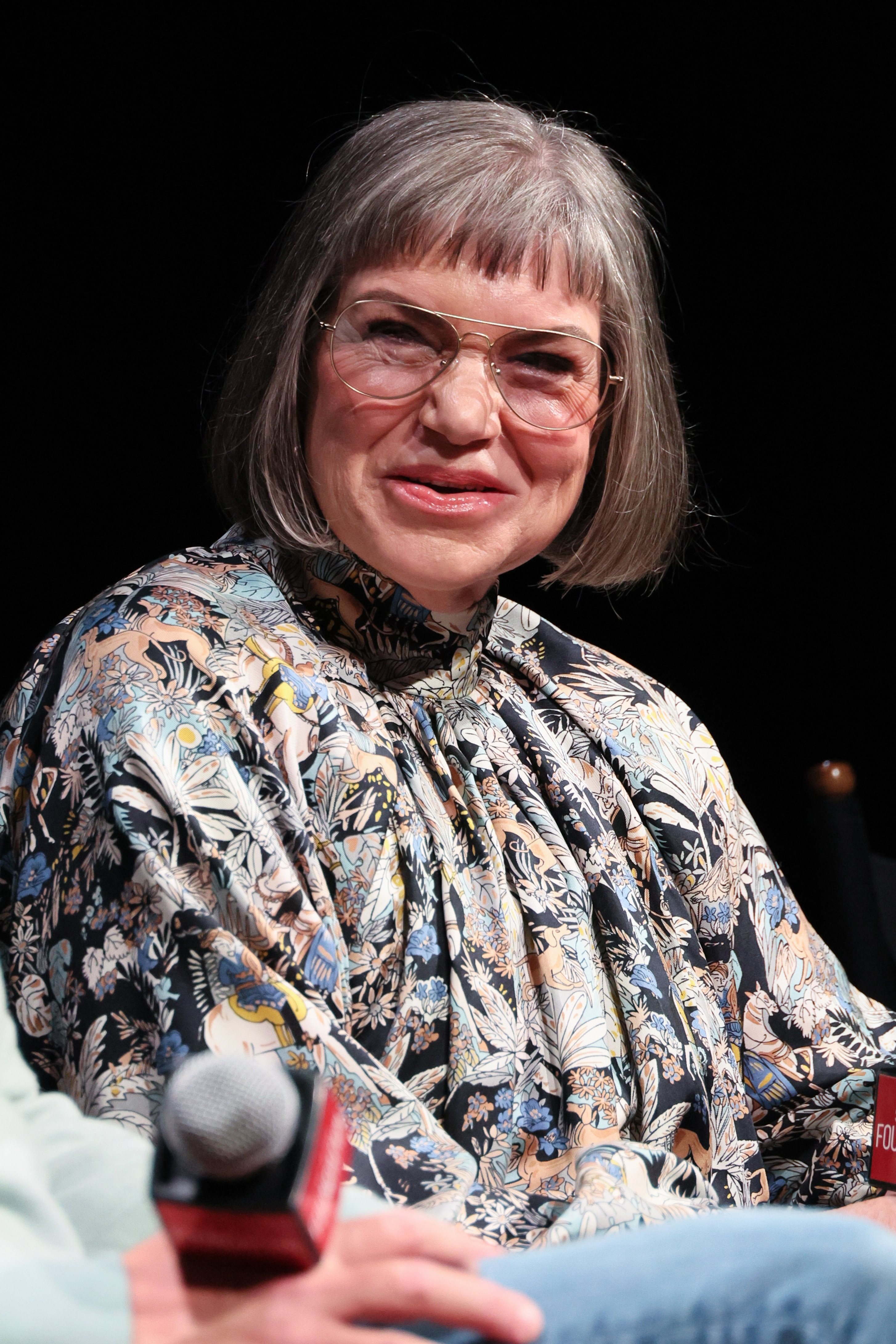 The '80s actress pictured speaking on stage on March 21, 2024 | Source: Getty Images