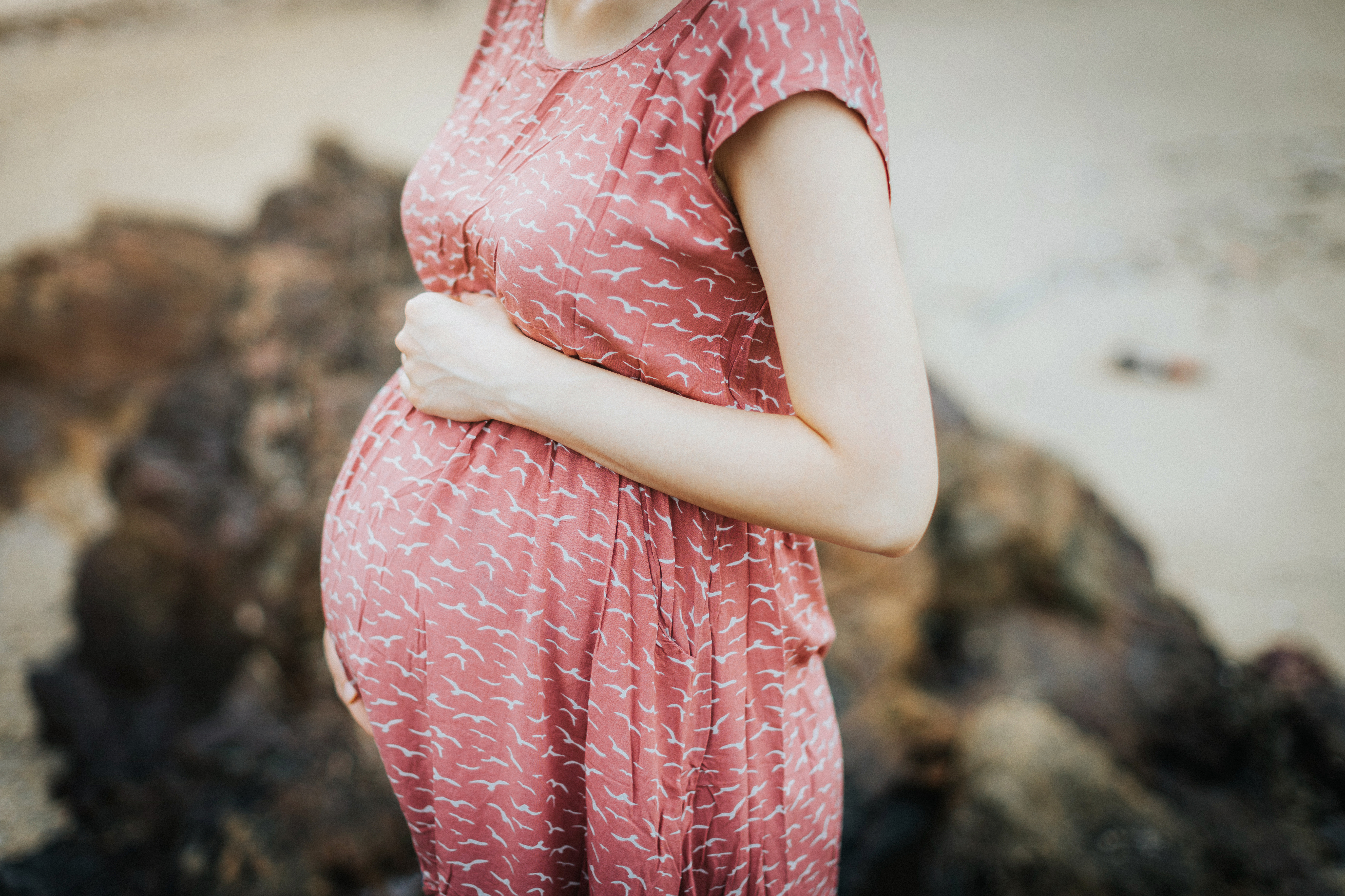 A pregnant woman holding her belly | Source: Getty Images