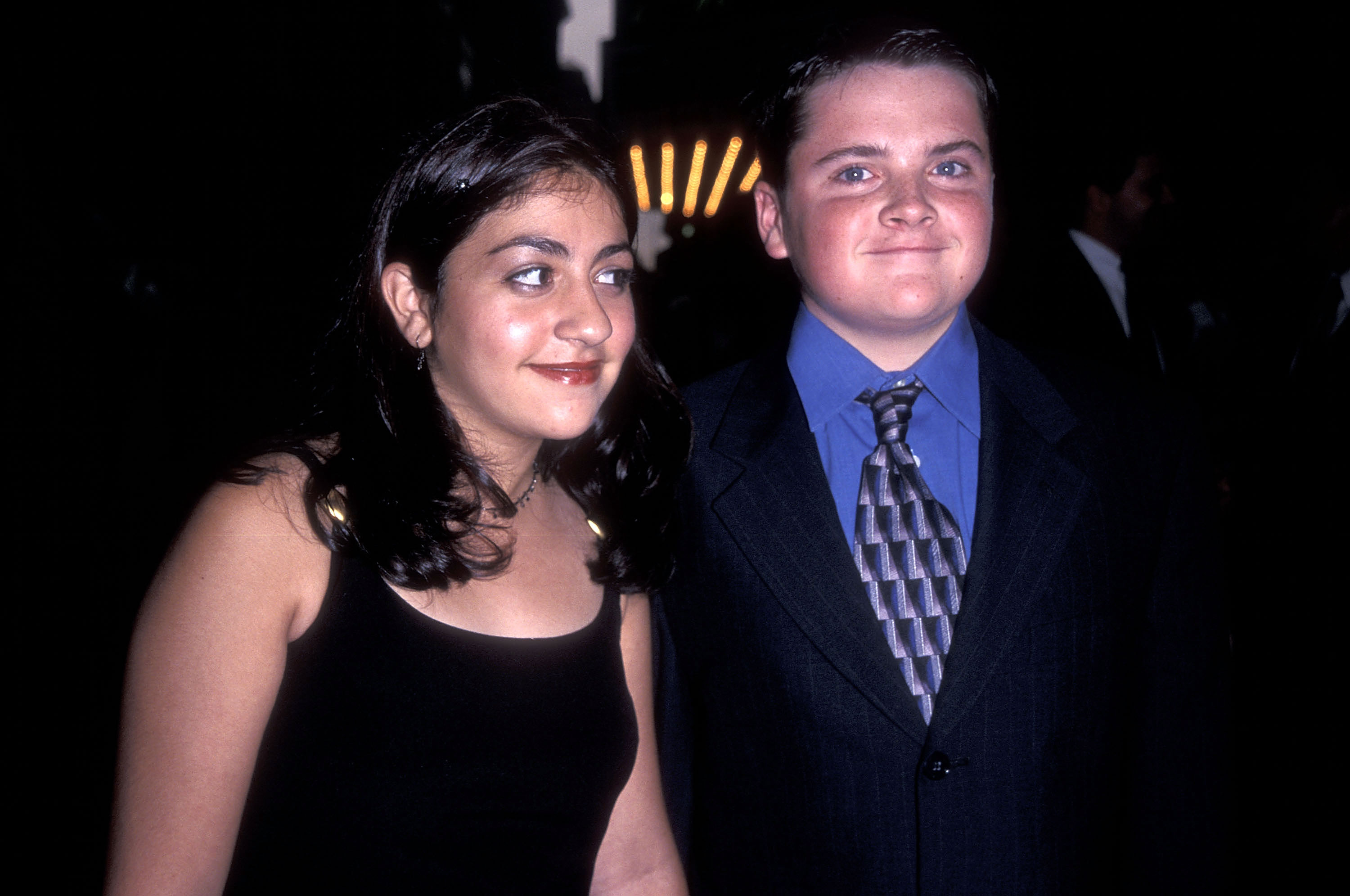 Robert Iler started his acting career at a young age before landing his breakout television role. In this photo, he and a guest attended the "Mickey Blue Eyes" Premiere at Ziegfeld Theatre on August 11, 1999, in New York City, New York. | Source: Getty Images