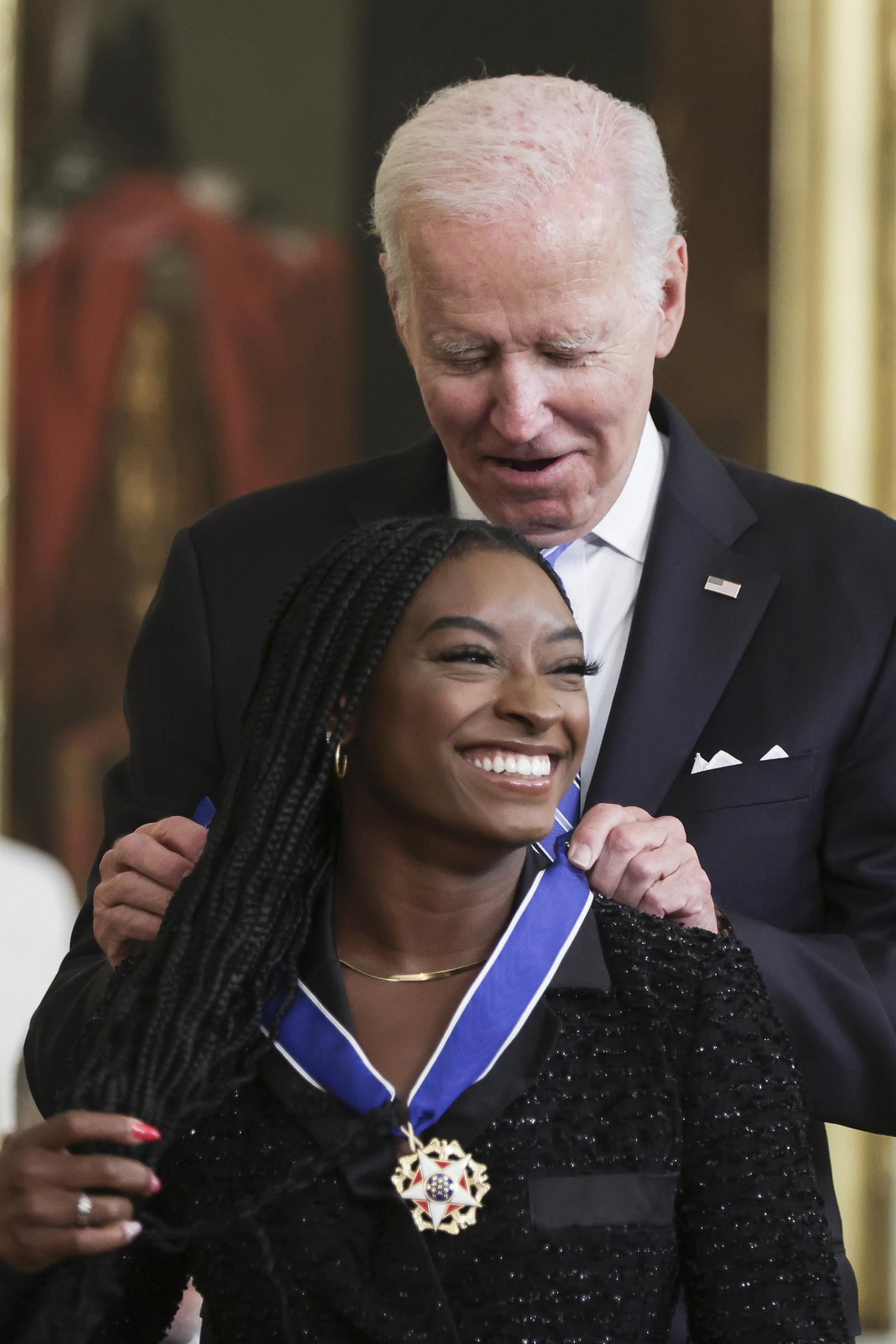 President Joe Biden presents the Presidential Medal of Freedom to Simone Biles during a ceremony in the White House on July 7, 2022, in Washington, DC. | Source: Getty Images