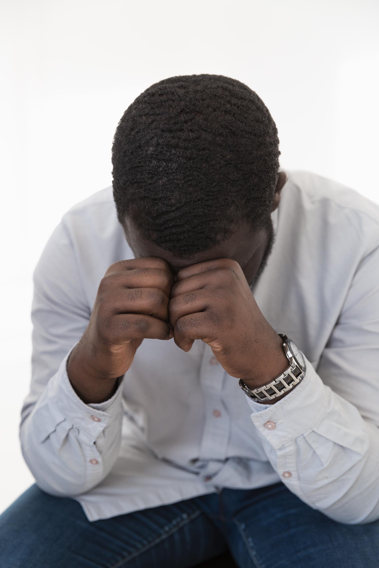 A depressed black man | Source: Freepik