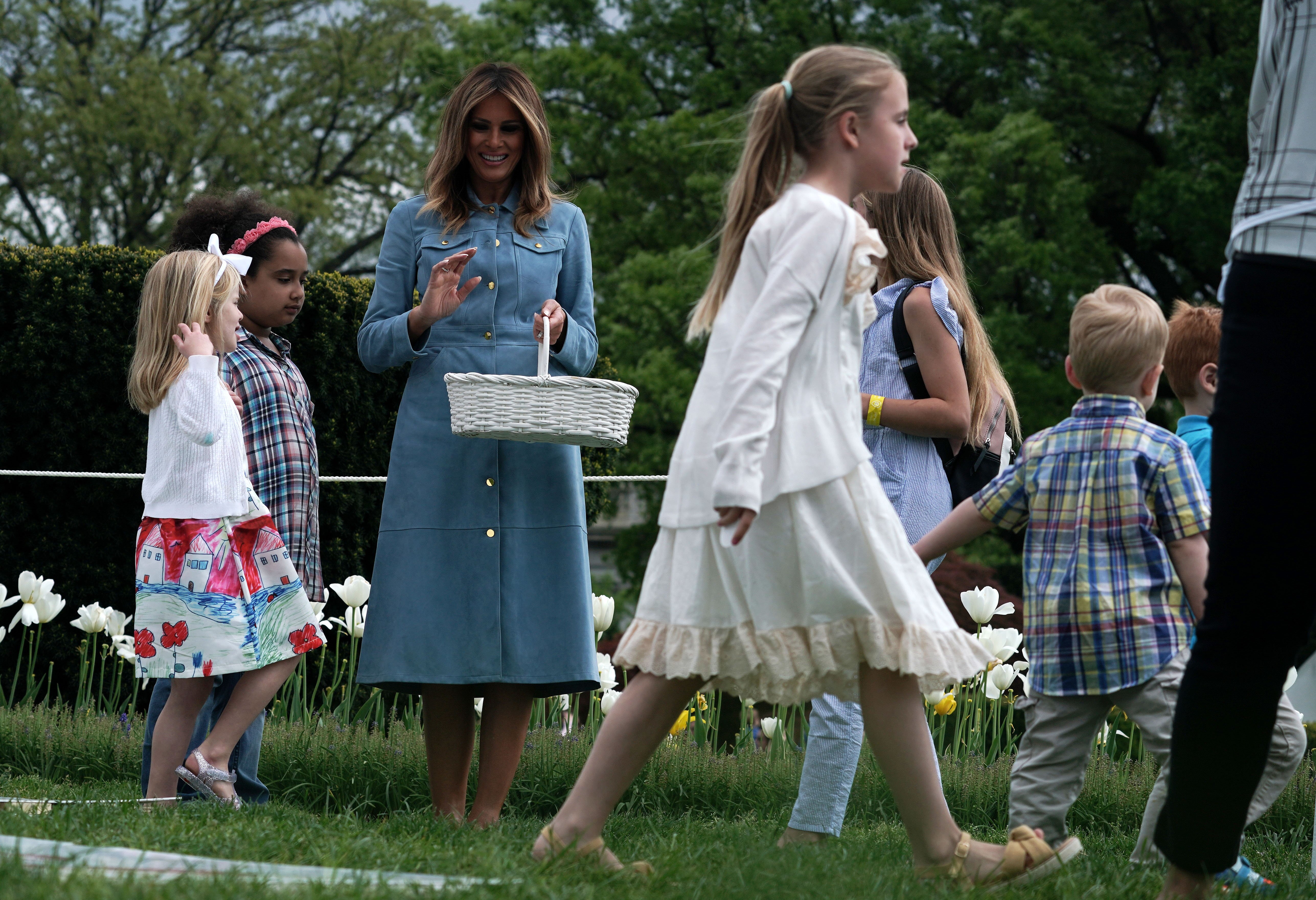 Melania Trump watching children participating in the 141st Easter Egg Roll | Photo: Getty Images