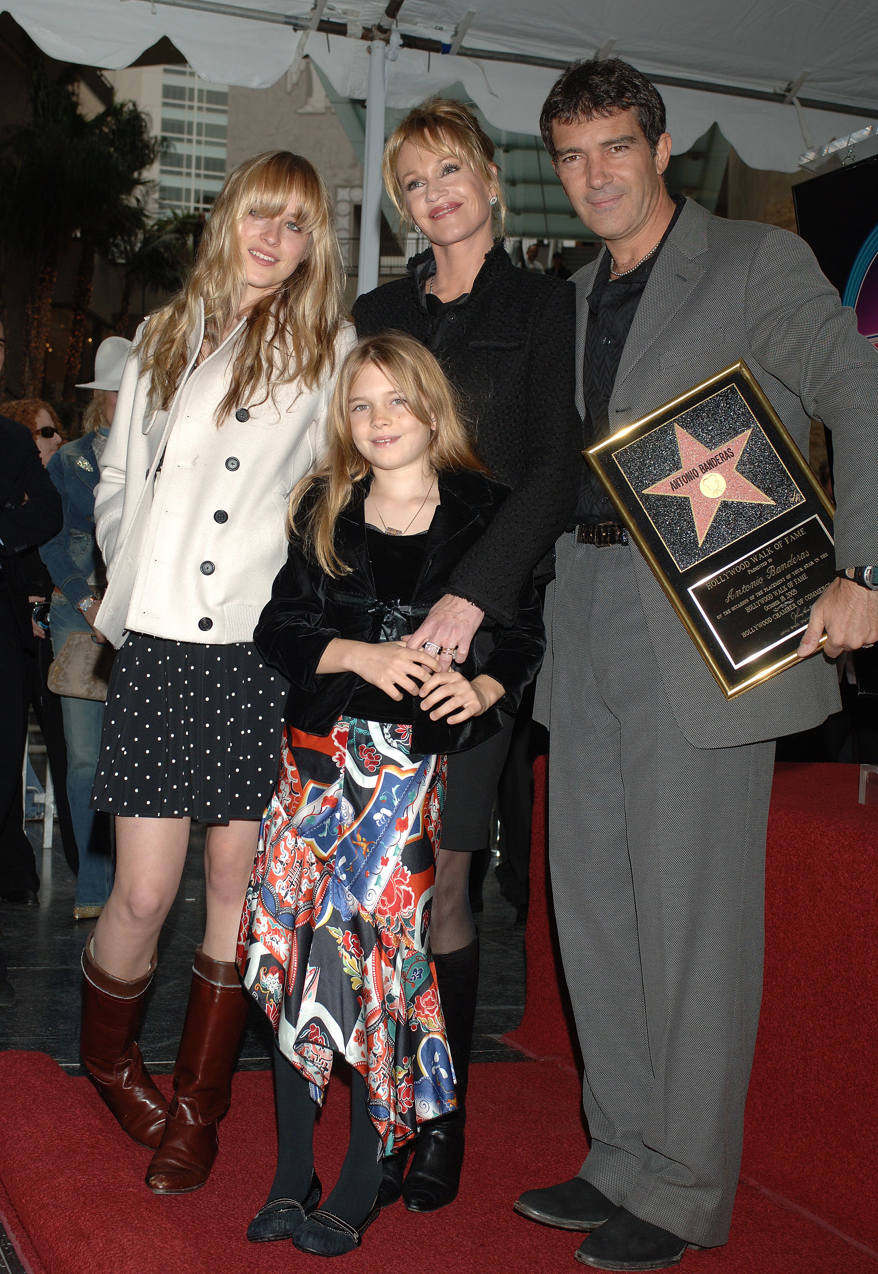 Antonio Banderas and Melanie Griffith with their daughters Stella Banderas and Dakota Johnson at his star ceremony on the Hollywood Walk of Fame on October 18, 2005 ┃Source: Getty Images