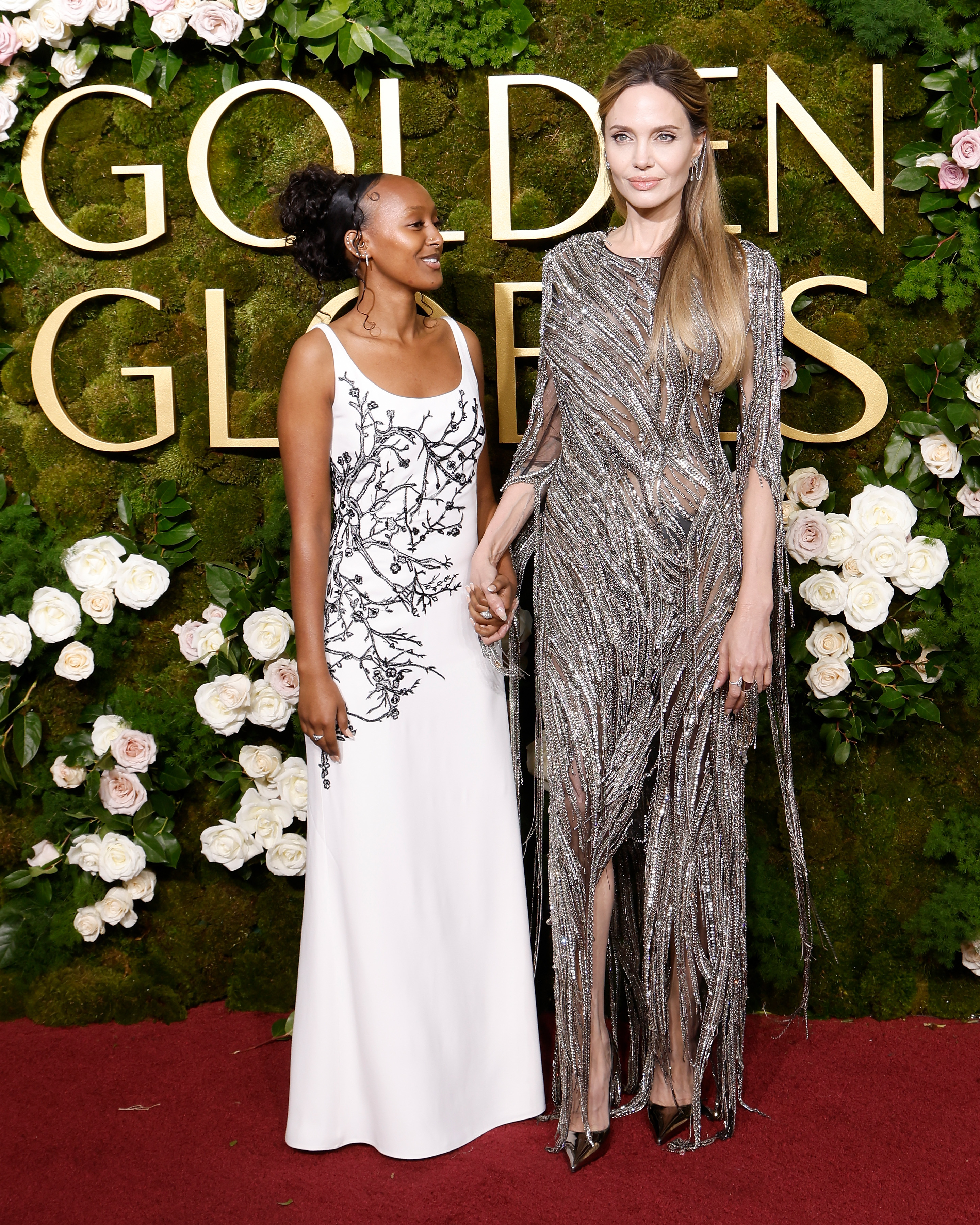 Zahara Jolie and Angelina Jolie attend the 2025 Golden Globe Awards at The Beverly Hilton in Beverly Hills, California, on January 5, 2025 | Source: Getty Images