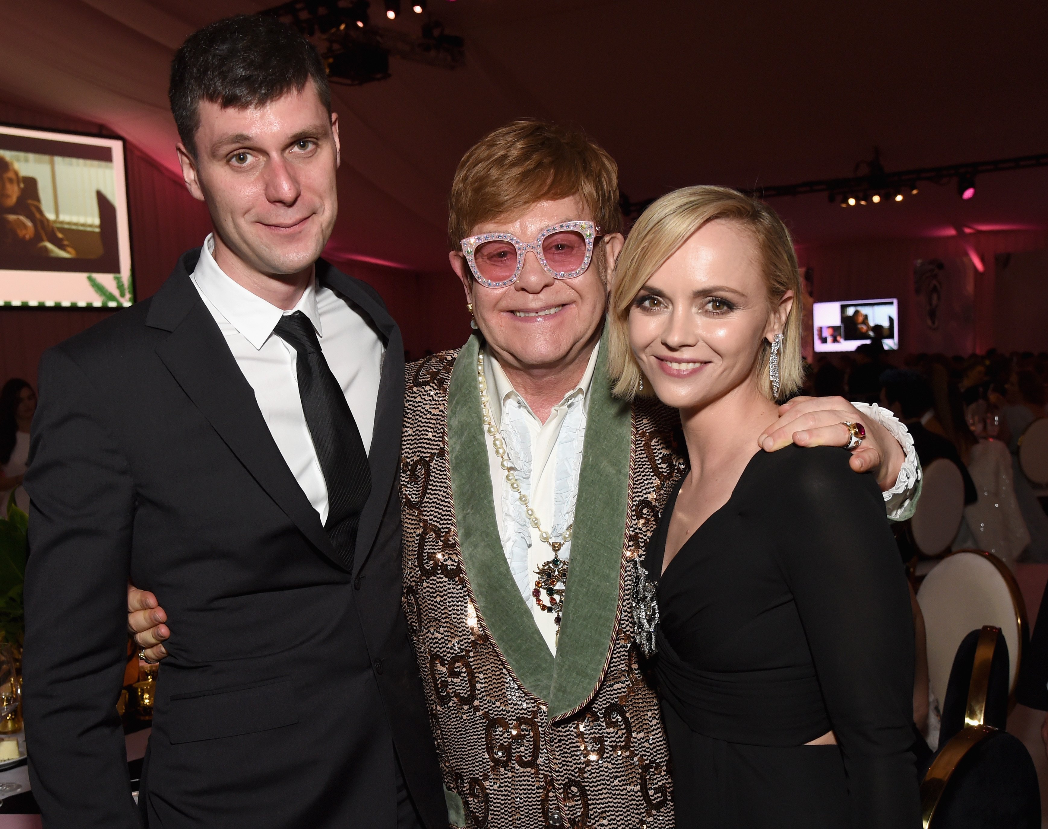 James Heerdegen, Sir Elton John, and Christina Ricci attend the 27th annual Elton John AIDS Foundation Academy Awards Viewing Party sponsored by IMDb and Neuro Drinks celebrating EJAF and the 91st Academy Awards on February 24, 2019, in West Hollywood, California. | Source: Getty Images
