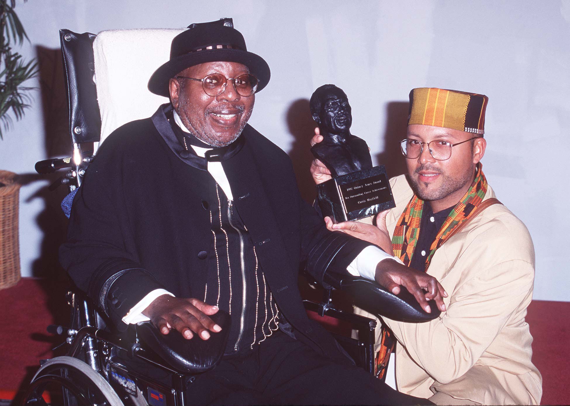 Curtis Mayfield and his son Tracy at the 11th Annual Soul Train Music Awards on March 07, 1997 in Los Angeles, California | Photo: Getty Images