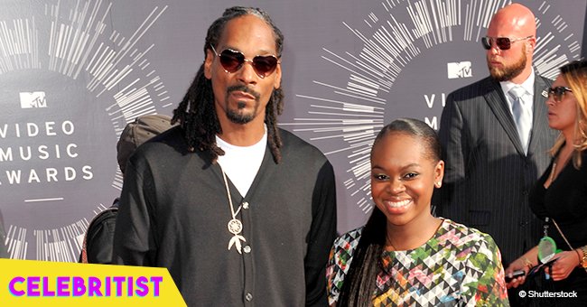 Snoop Dogg's teen daughter stops hearts in figure-hugging red dress, rocking a shaved head